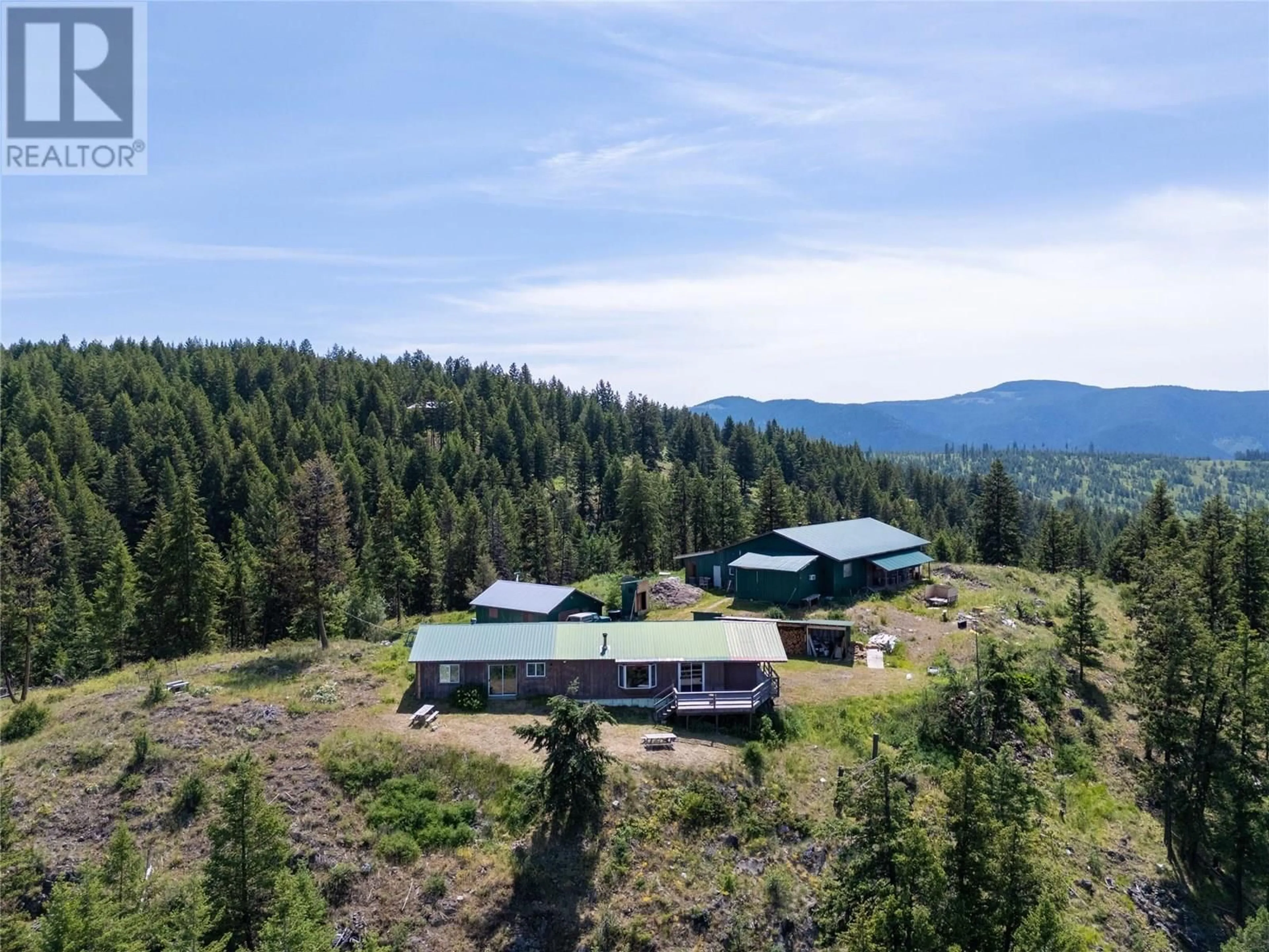 A pic from outside/outdoor area/front of a property/back of a property/a pic from drone, mountain view for 335 SOLOMON ROAD, Beaverdell British Columbia V0H1A0