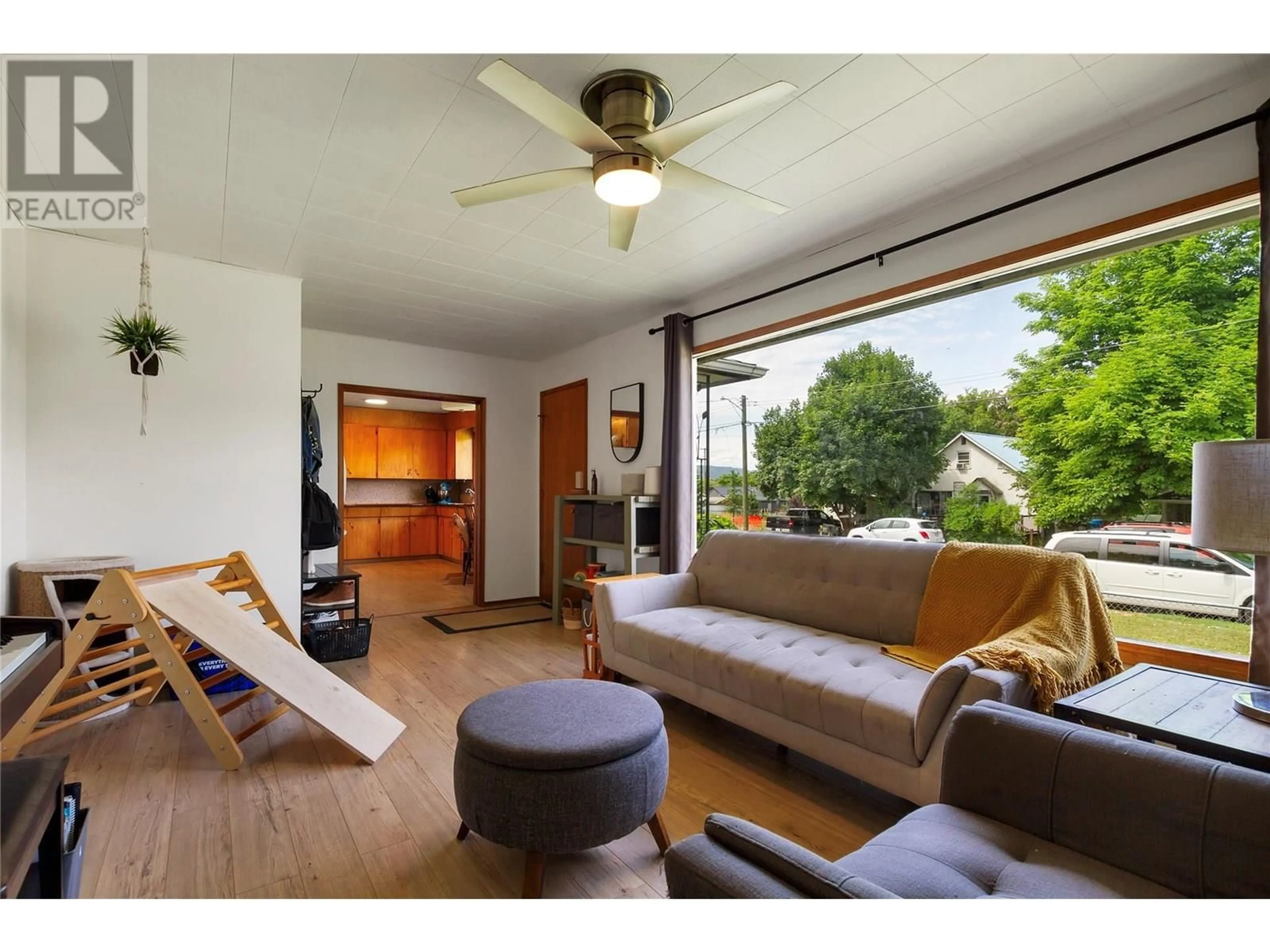 Living room with furniture, wood/laminate floor for 4205 30 STREET, Vernon British Columbia V1T5G2