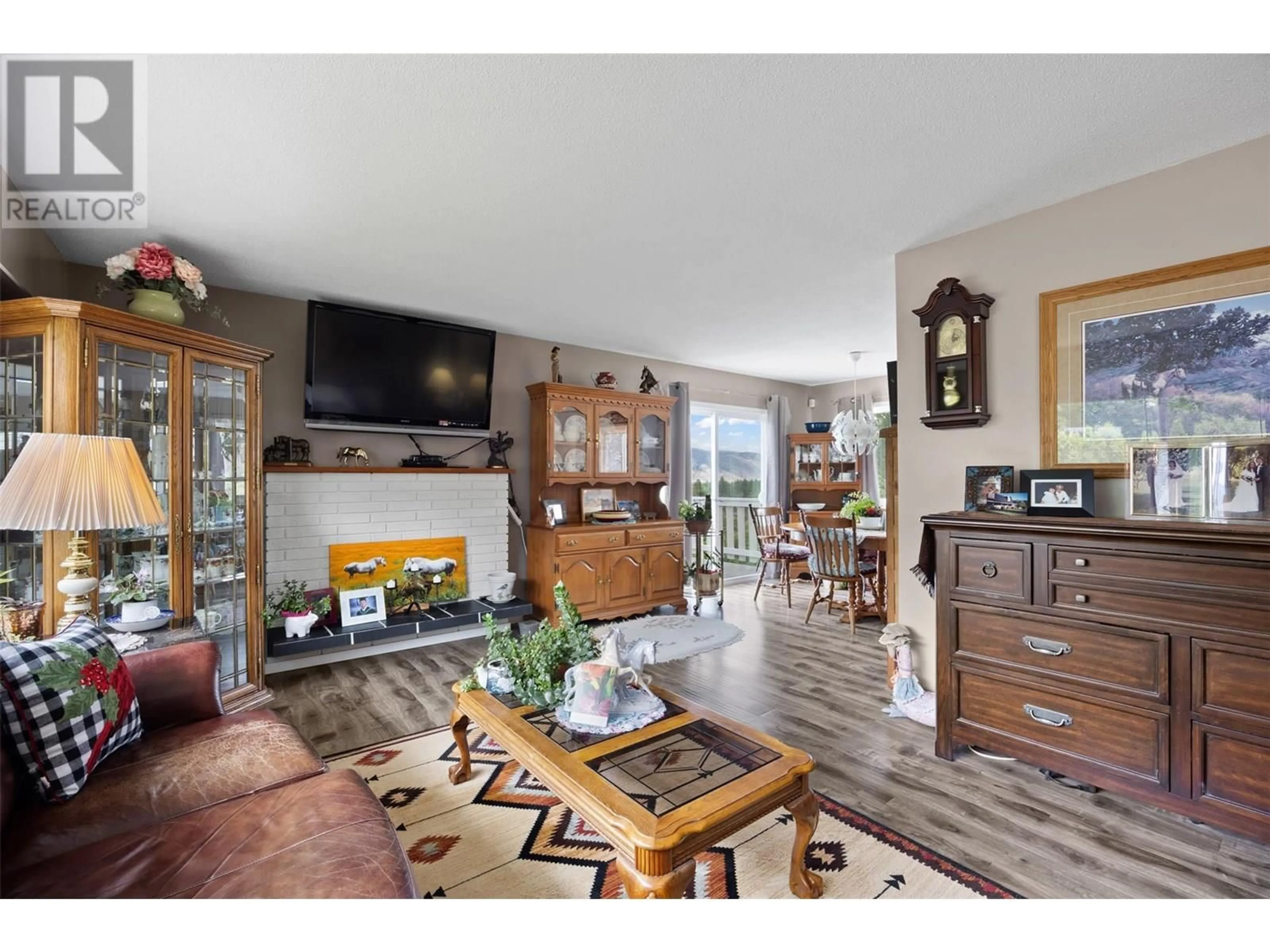 Living room with furniture, wood/laminate floor for 6011 TODD ROAD, Kamloops British Columbia V2C5B9