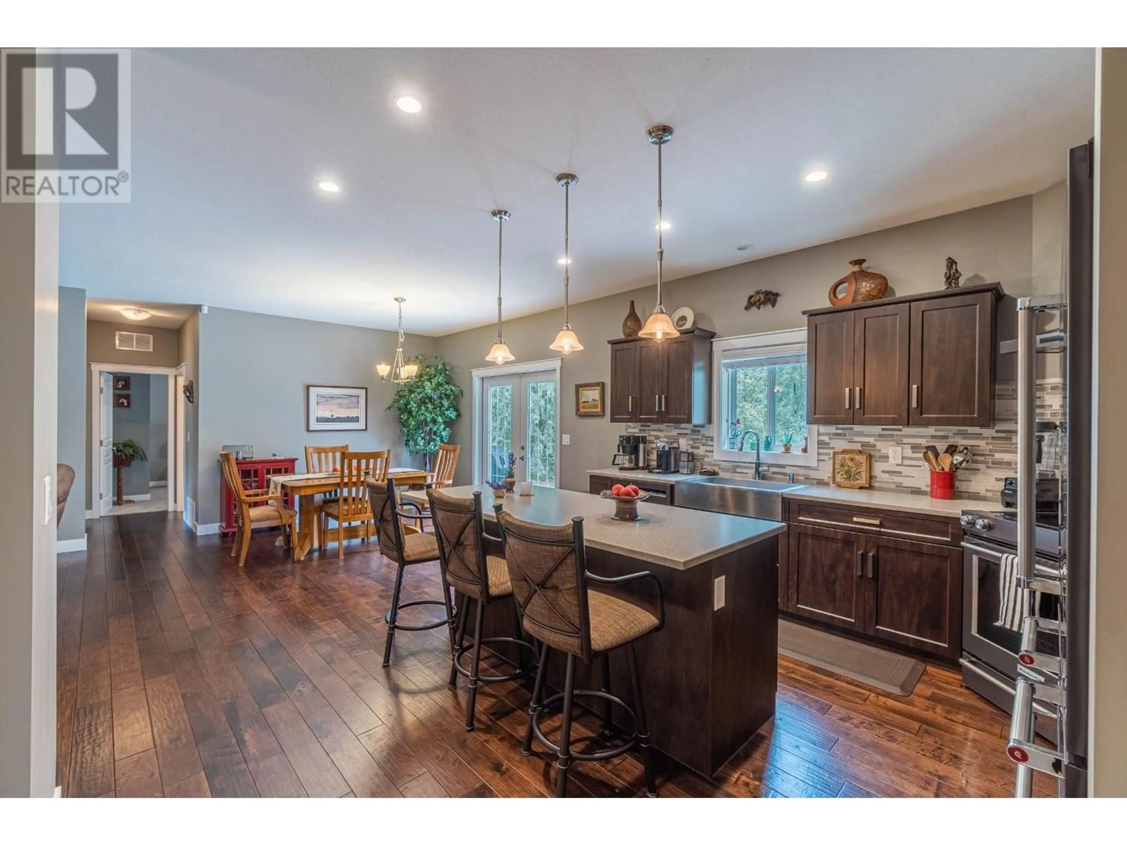 Open concept kitchen, wood/laminate floor for 3395 SHUSWAP ROAD, Kamloops British Columbia V2H1T2