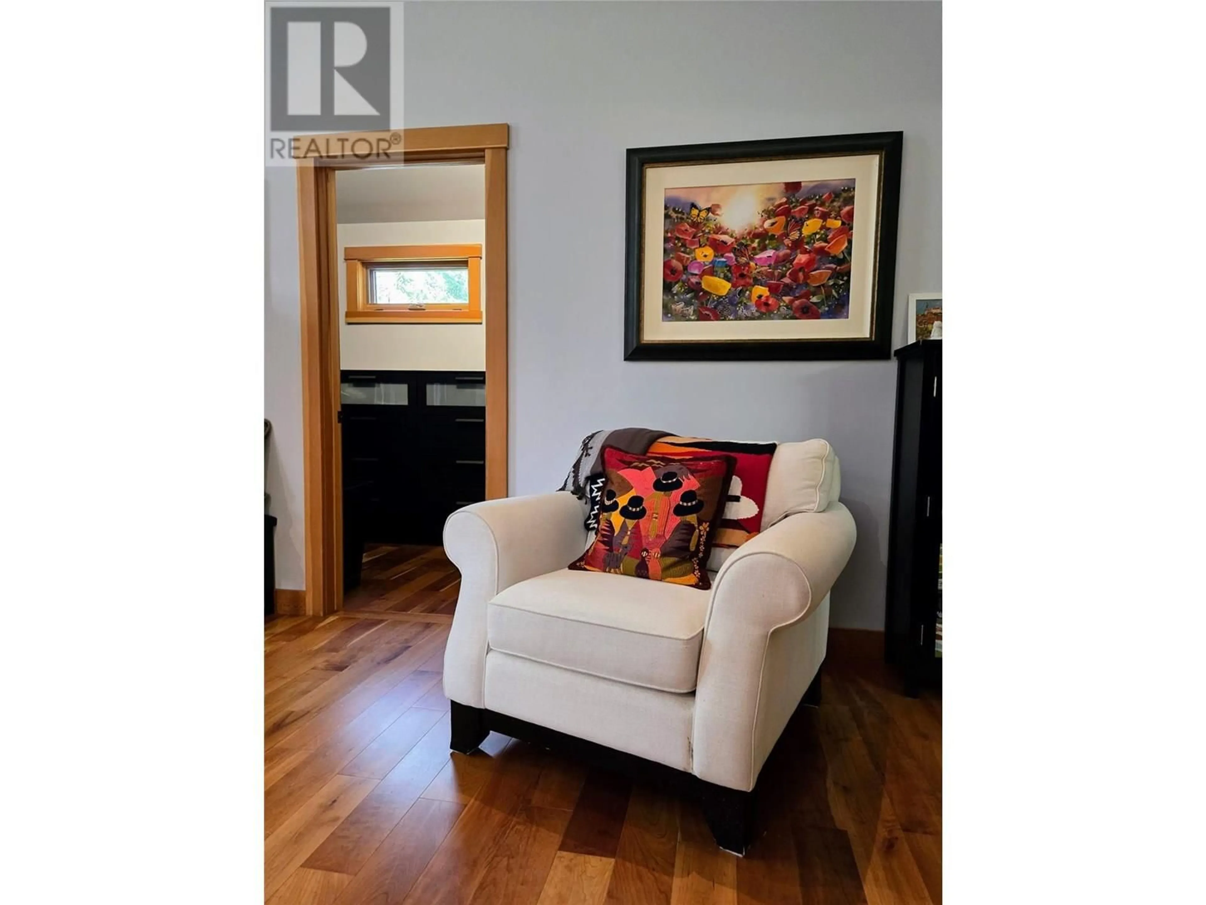 Living room with furniture, wood/laminate floor for 2517 COBBLESTONE TRAIL, Invermere British Columbia V0A1K6