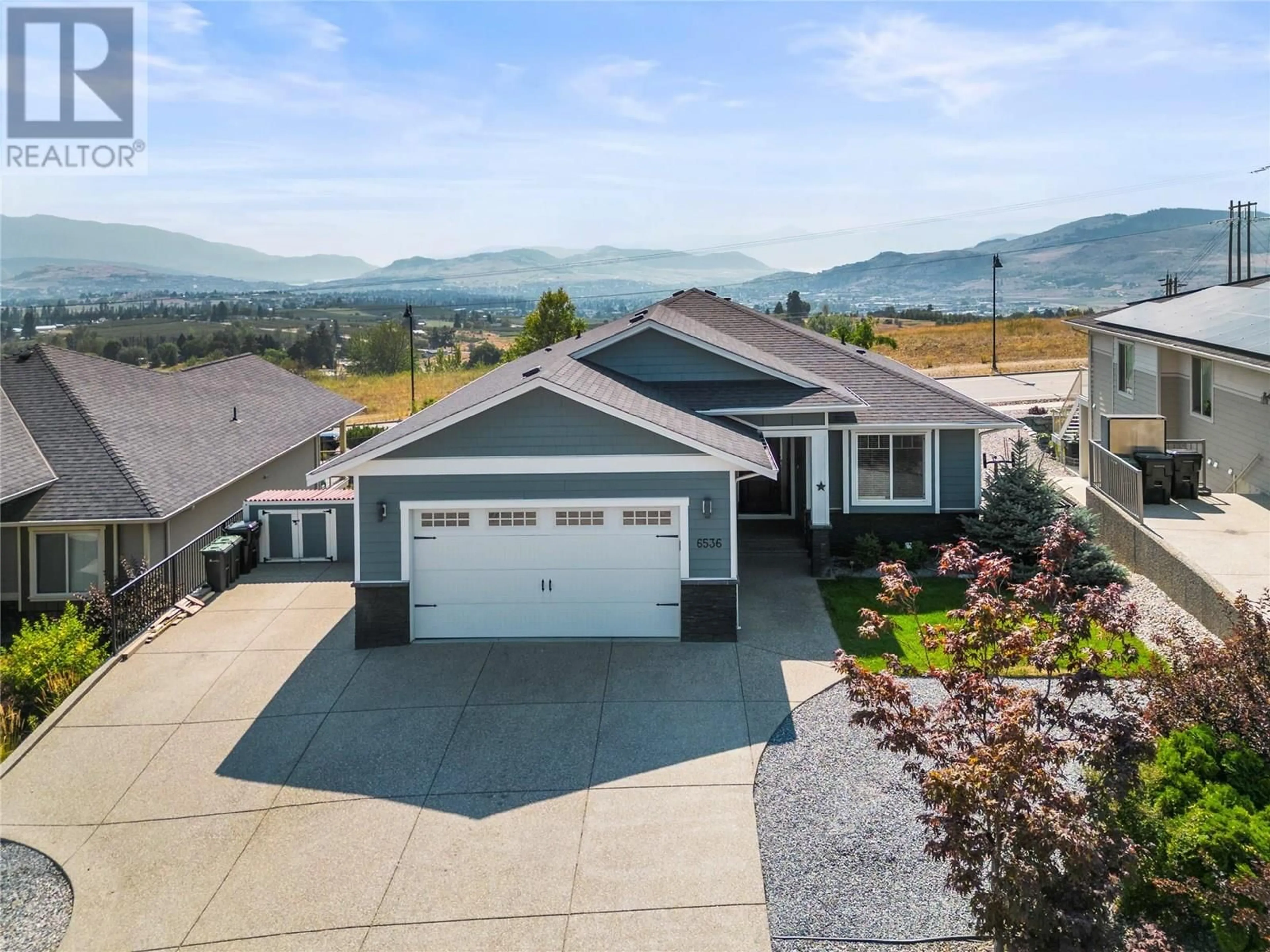 A pic from outside/outdoor area/front of a property/back of a property/a pic from drone, mountain view for 6536 BLACKCOMB PLACE, Vernon British Columbia V1B4E1