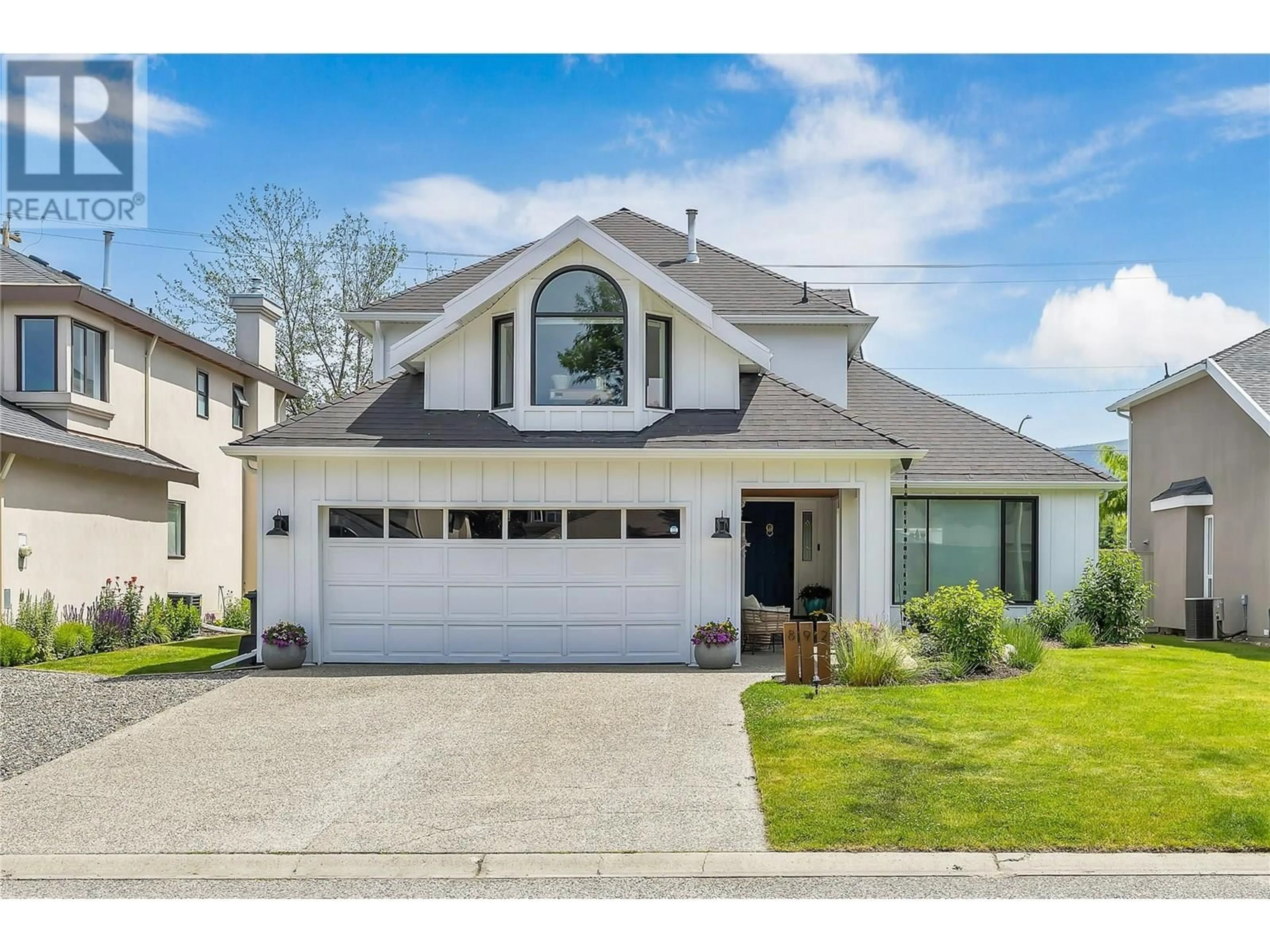 Home with vinyl exterior material, street for 892 MISSION SPRINGS CRESCENT, Kelowna British Columbia V1W3L9