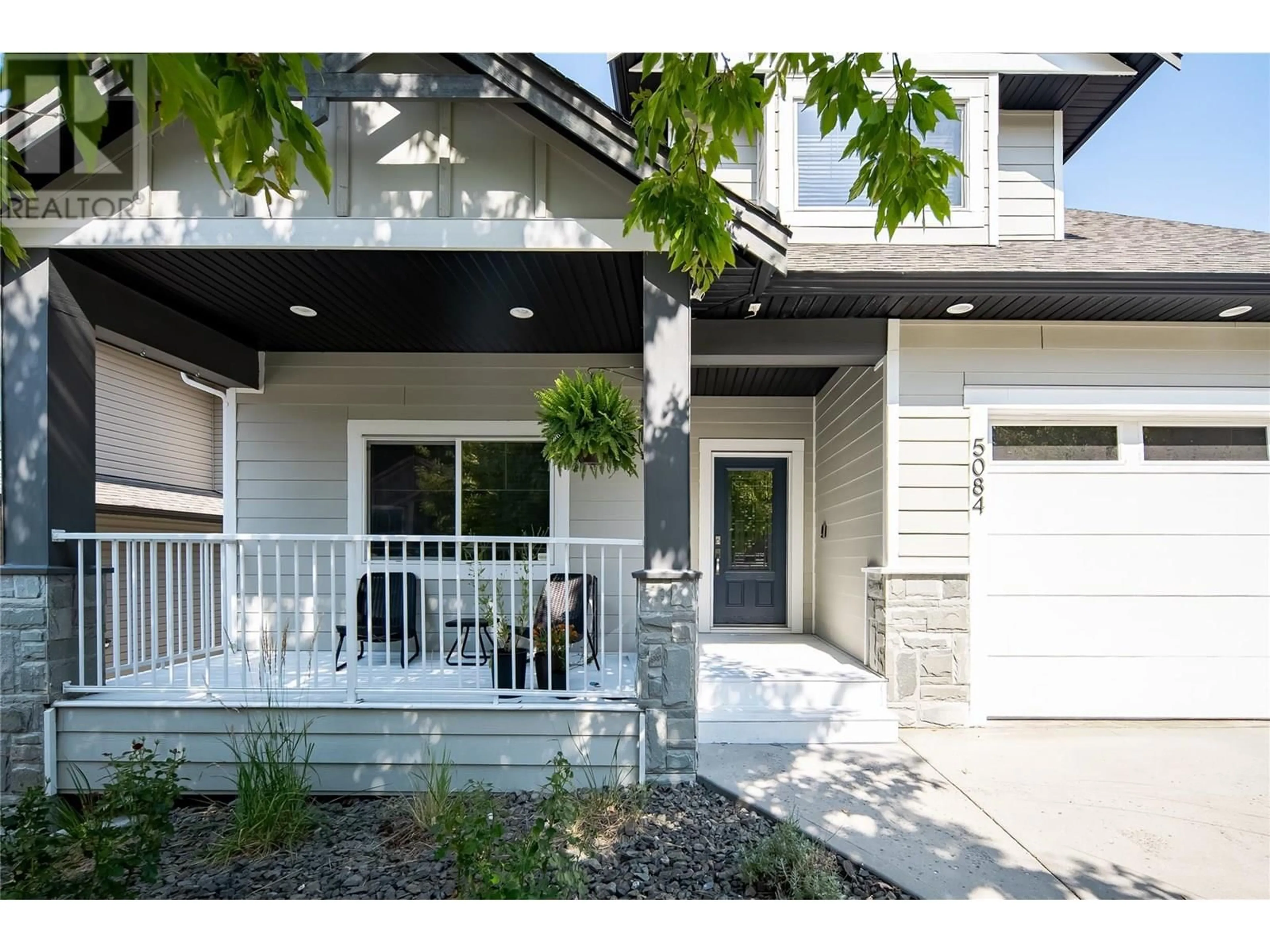 Home with vinyl exterior material, street for 5084 SEON CRESCENT, Kelowna British Columbia V1W5G8