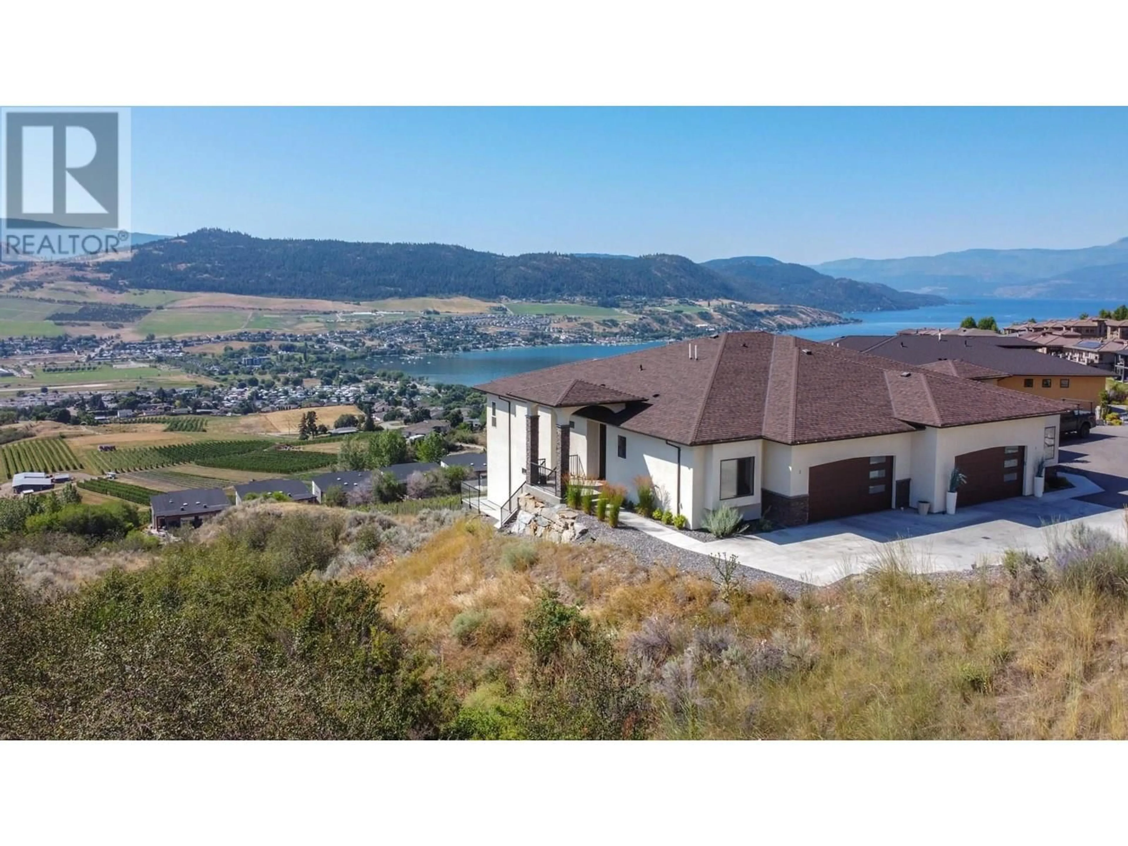 A pic from outside/outdoor area/front of a property/back of a property/a pic from drone, water/lake/river/ocean view for 2 - 7716 OKANAGAN HILLS BOULEVARD, Vernon British Columbia V1H1Z9