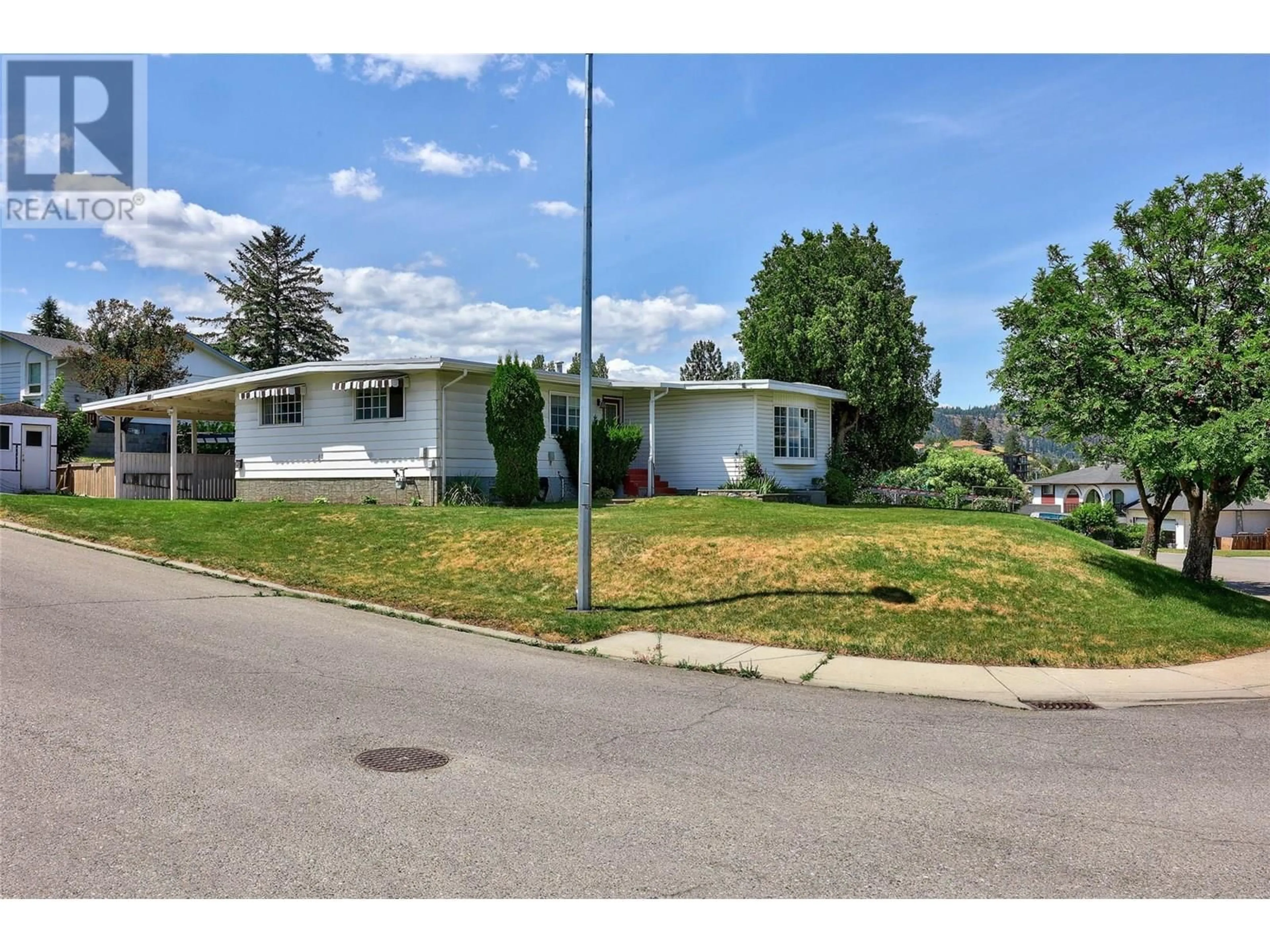 Home with vinyl exterior material, street for 135 WHITESHIELD CRESCENT, Kamloops British Columbia V2E1H2