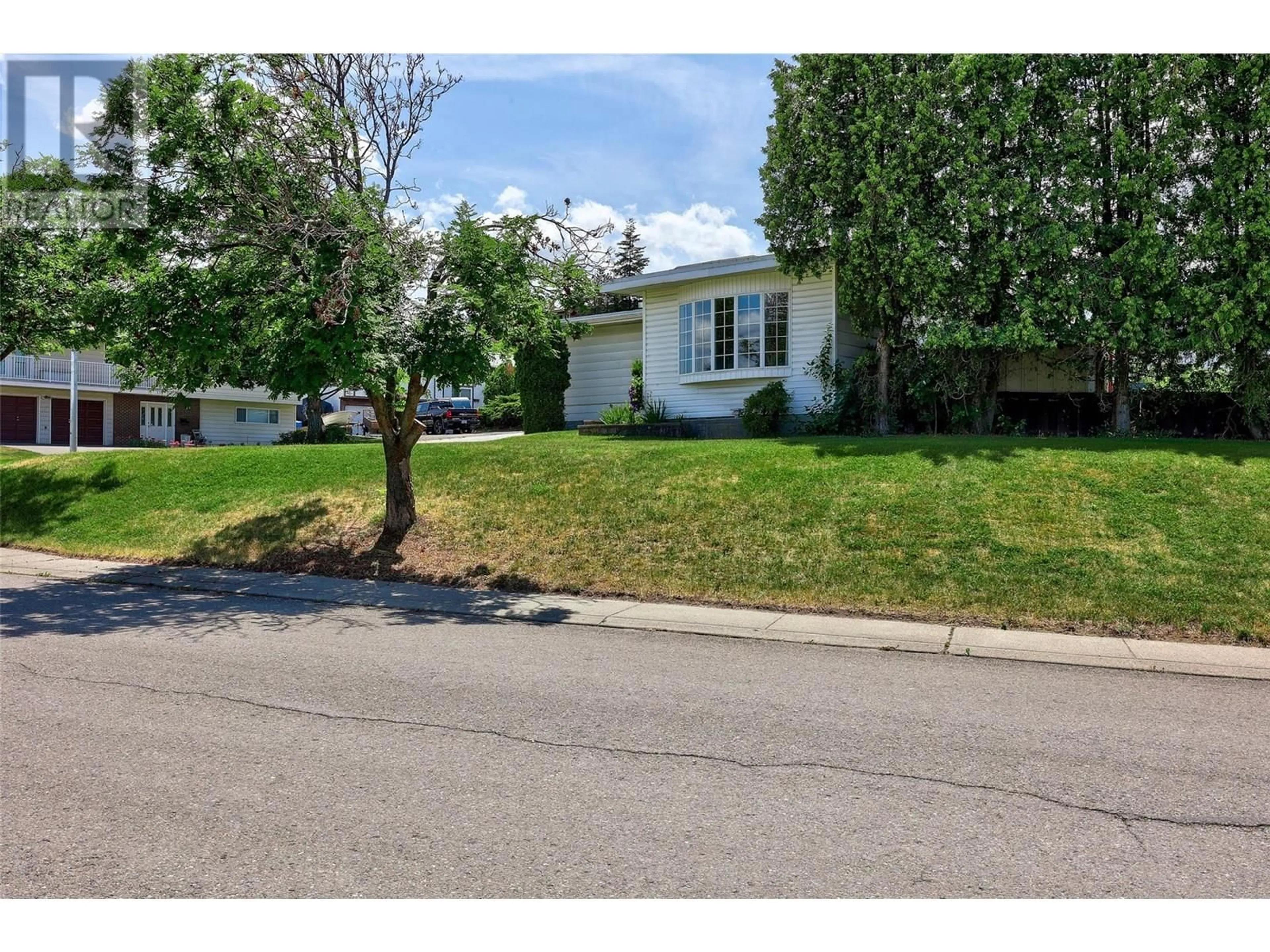 Home with vinyl exterior material, street for 135 WHITESHIELD CRESCENT, Kamloops British Columbia V2E1H2
