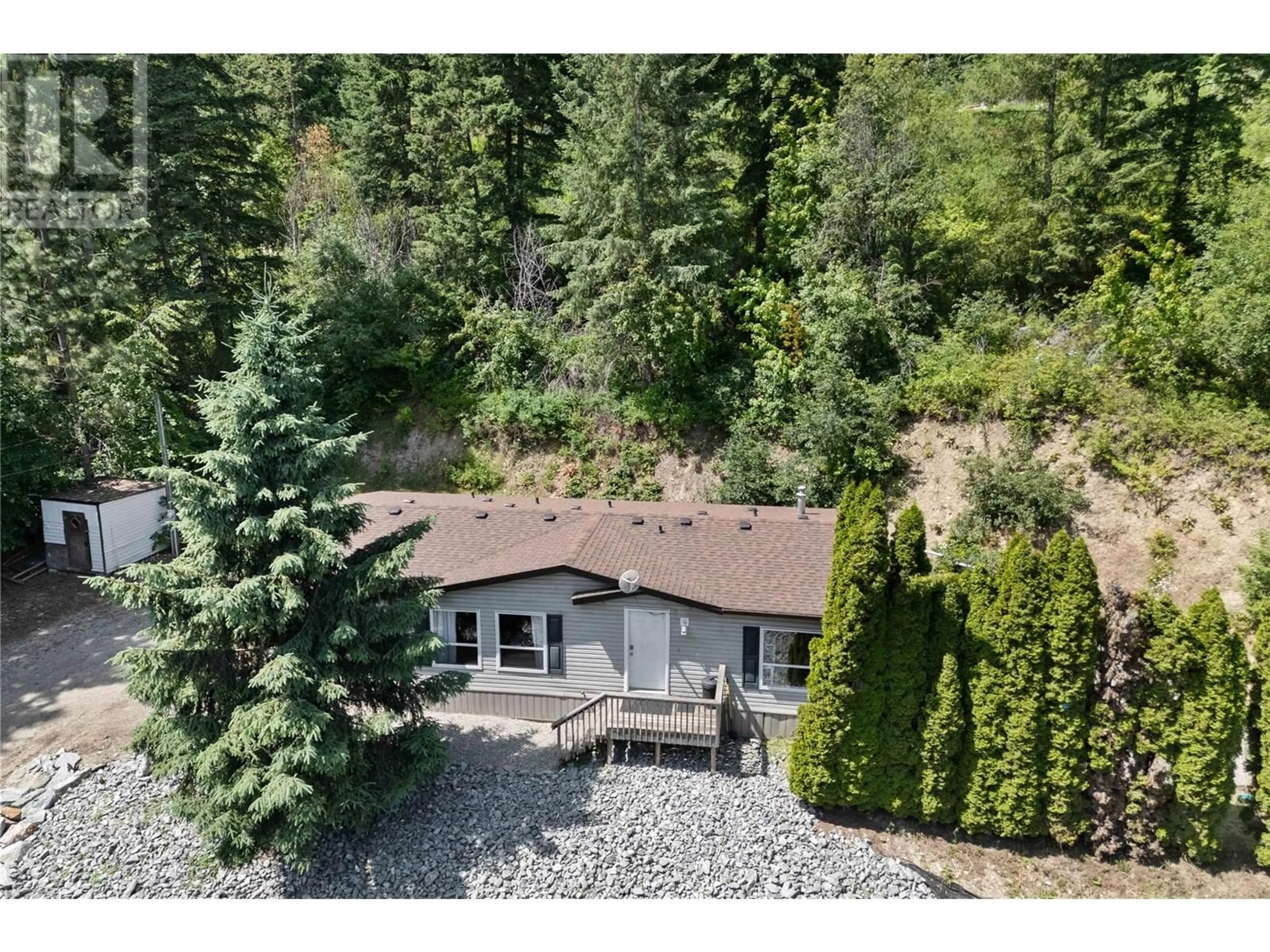 A pic from outside/outdoor area/front of a property/back of a property/a pic from drone, forest/trees view for 6216 97A HIGHWAY, Enderby British Columbia V0E1V3