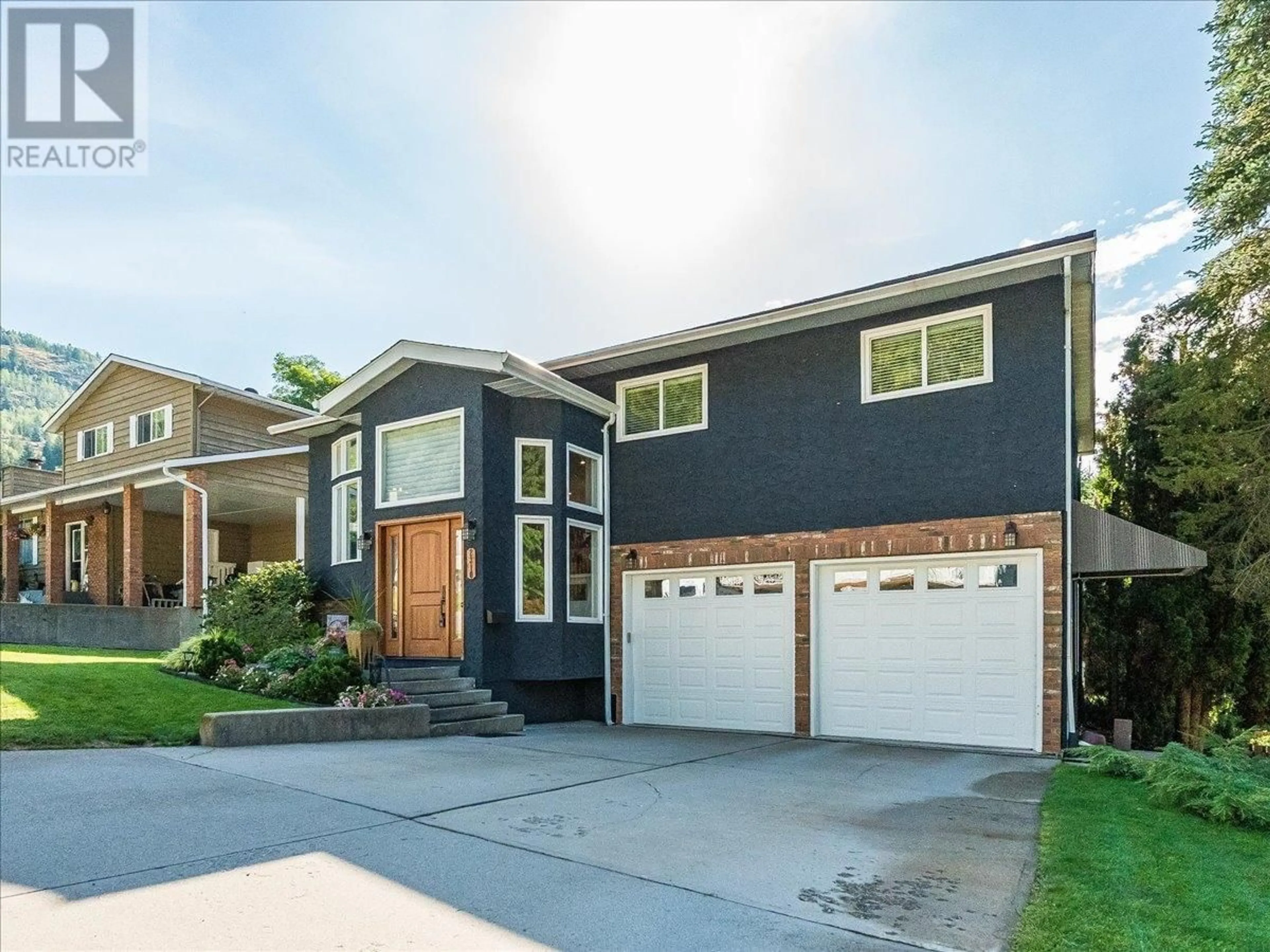 Home with brick exterior material, street for 2310 MCBRIDE STREET, Trail British Columbia V1R4N8