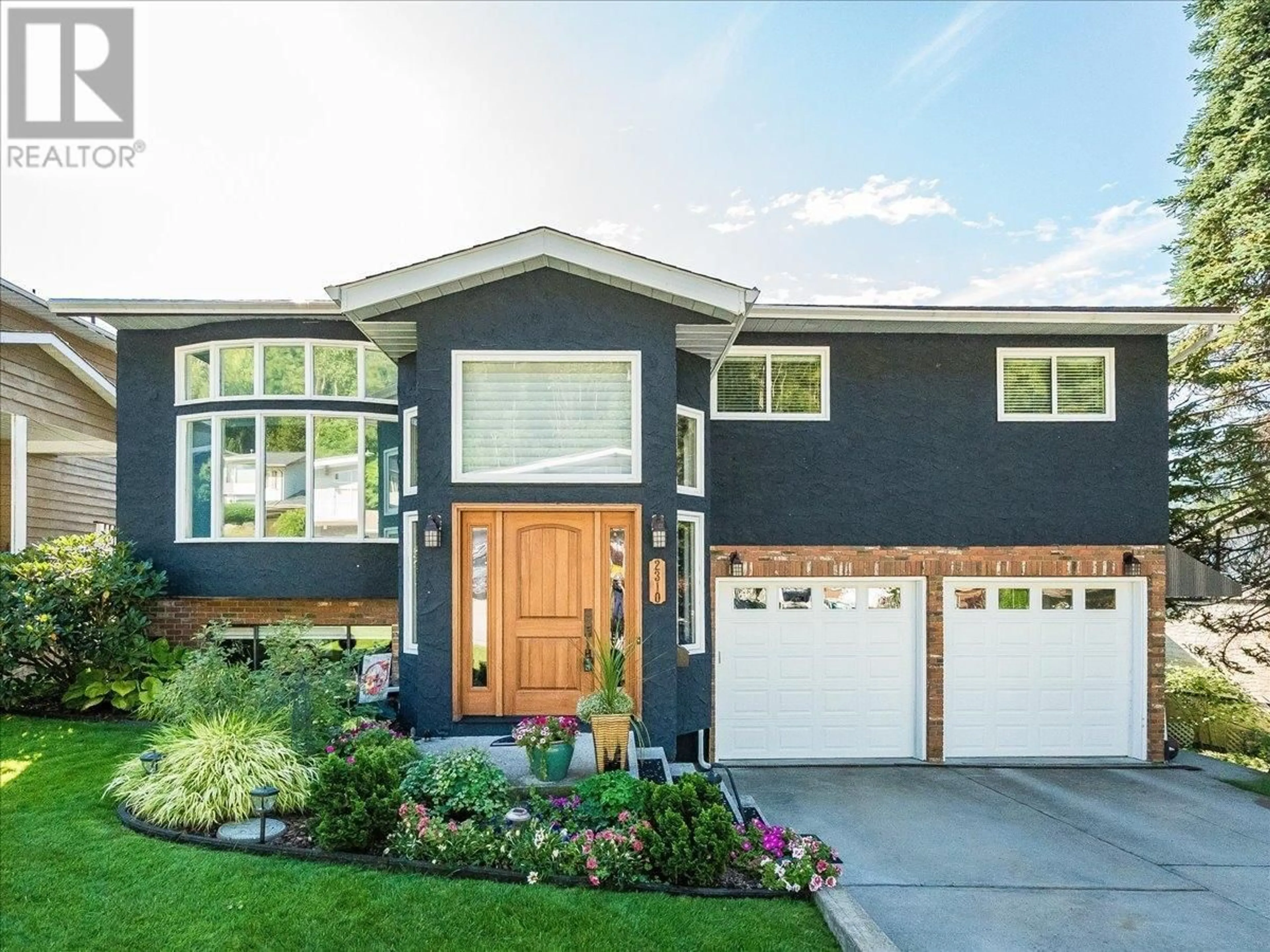 Home with brick exterior material, street for 2310 MCBRIDE STREET, Trail British Columbia V1R4N8