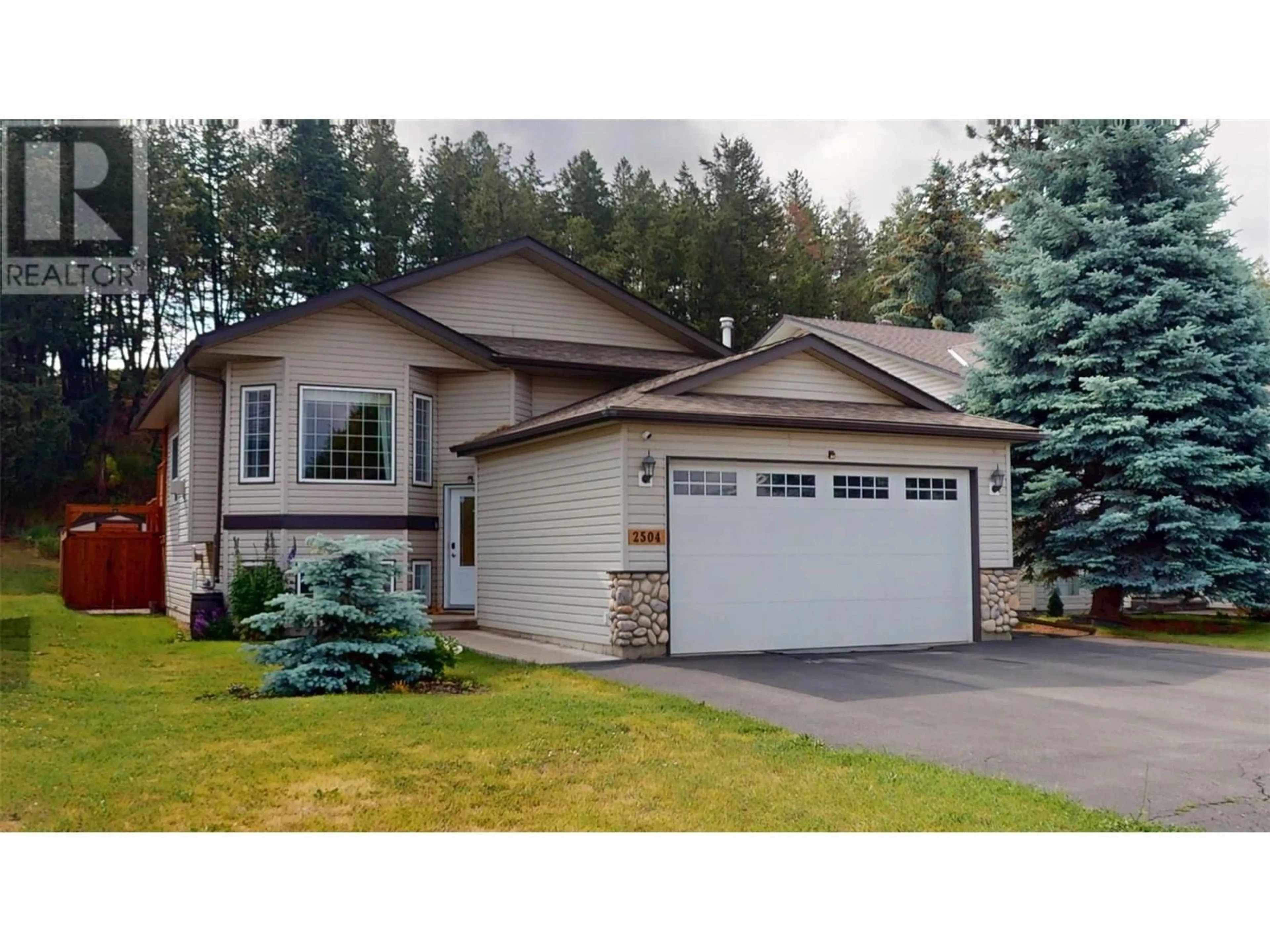 Home with vinyl exterior material, street for 2504 MCLEARY CRESCENT NORTH, Cranbrook British Columbia V1C6R7