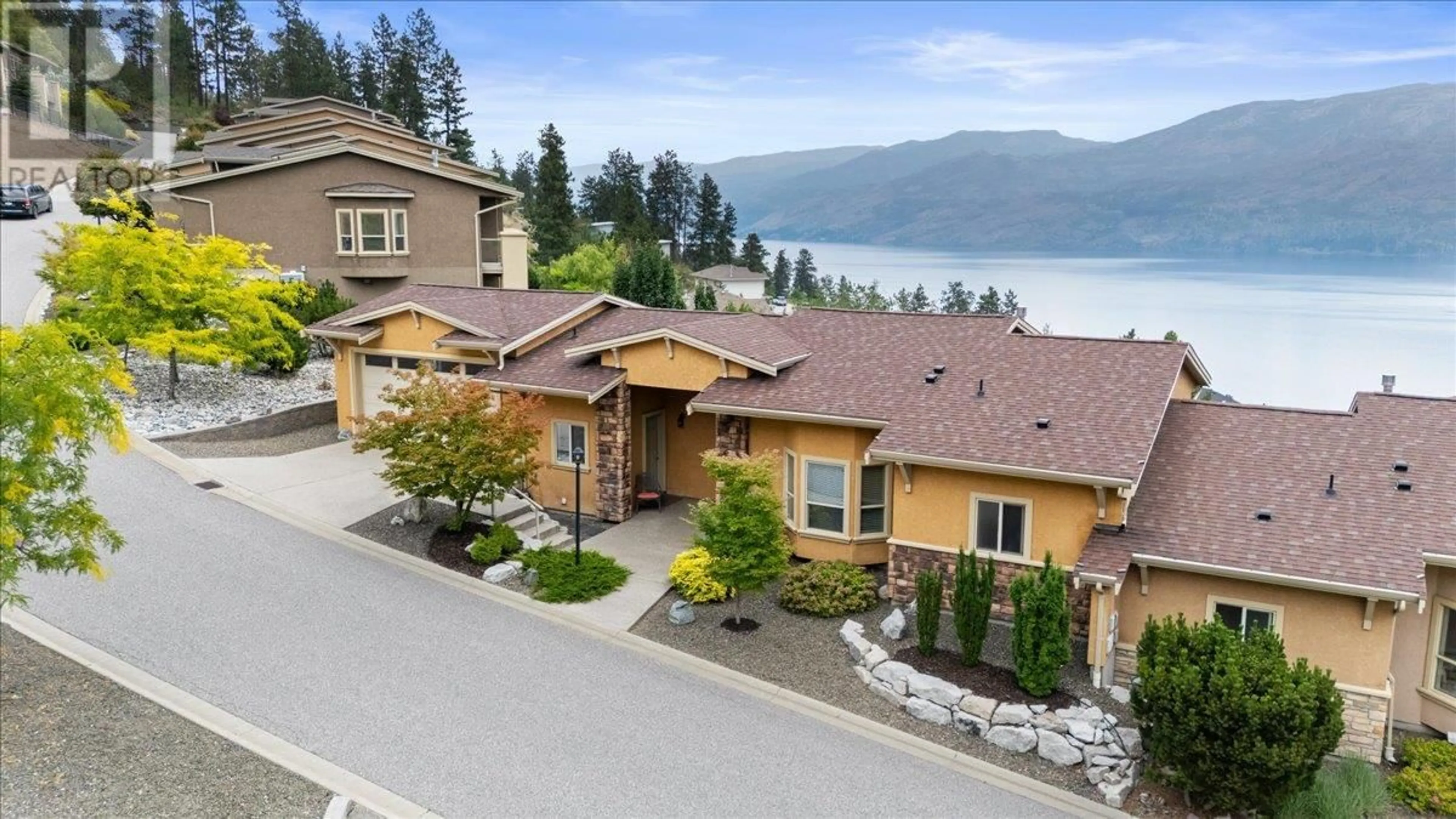 A pic from outside/outdoor area/front of a property/back of a property/a pic from drone, water/lake/river/ocean view for 235 - 5165 TREPANIER BENCH ROAD, Peachland British Columbia V0H1X2