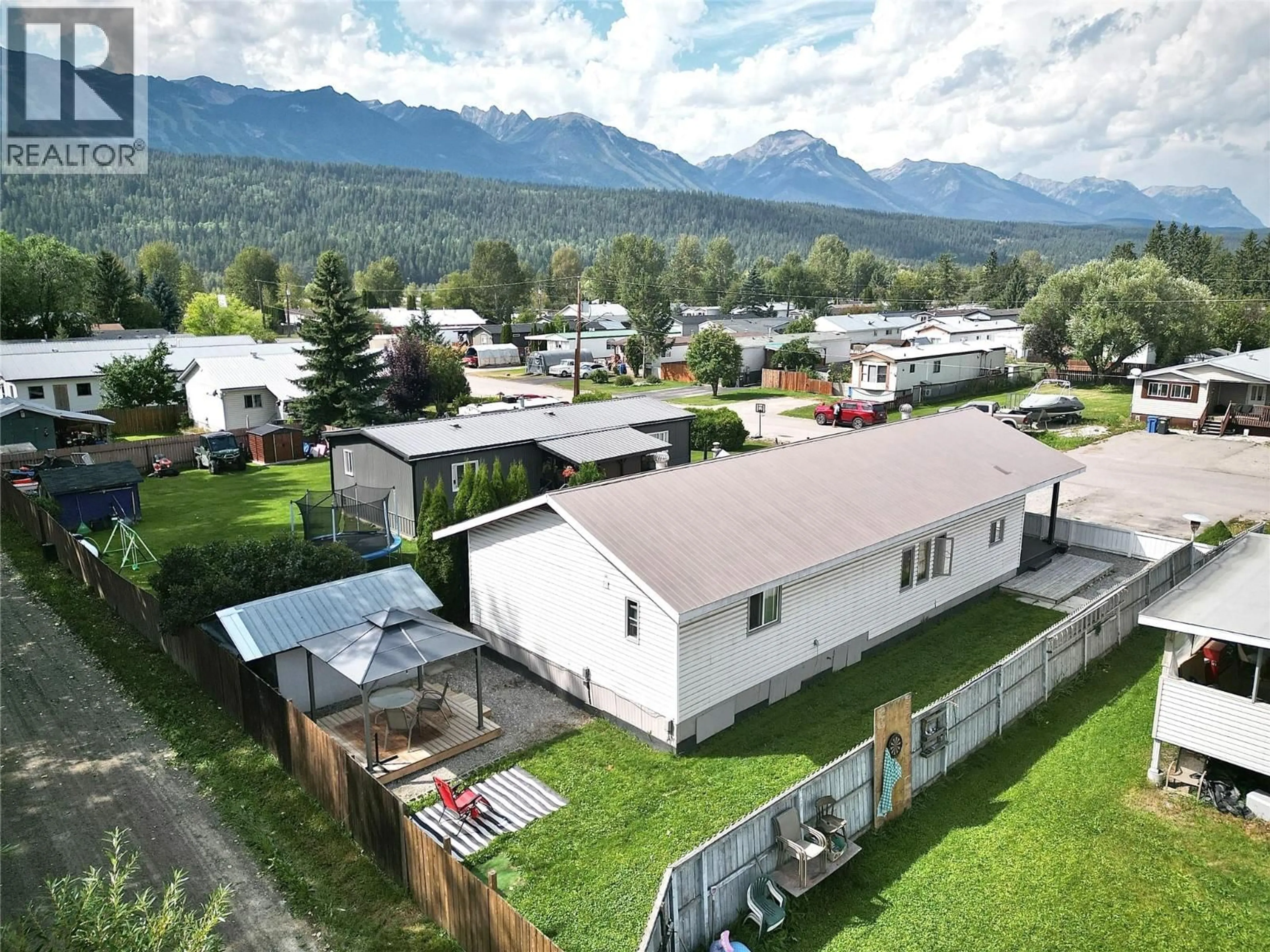 A pic from outside/outdoor area/front of a property/back of a property/a pic from drone, mountain view for 1011 KING CRESCENT, Golden British Columbia V0A1H2