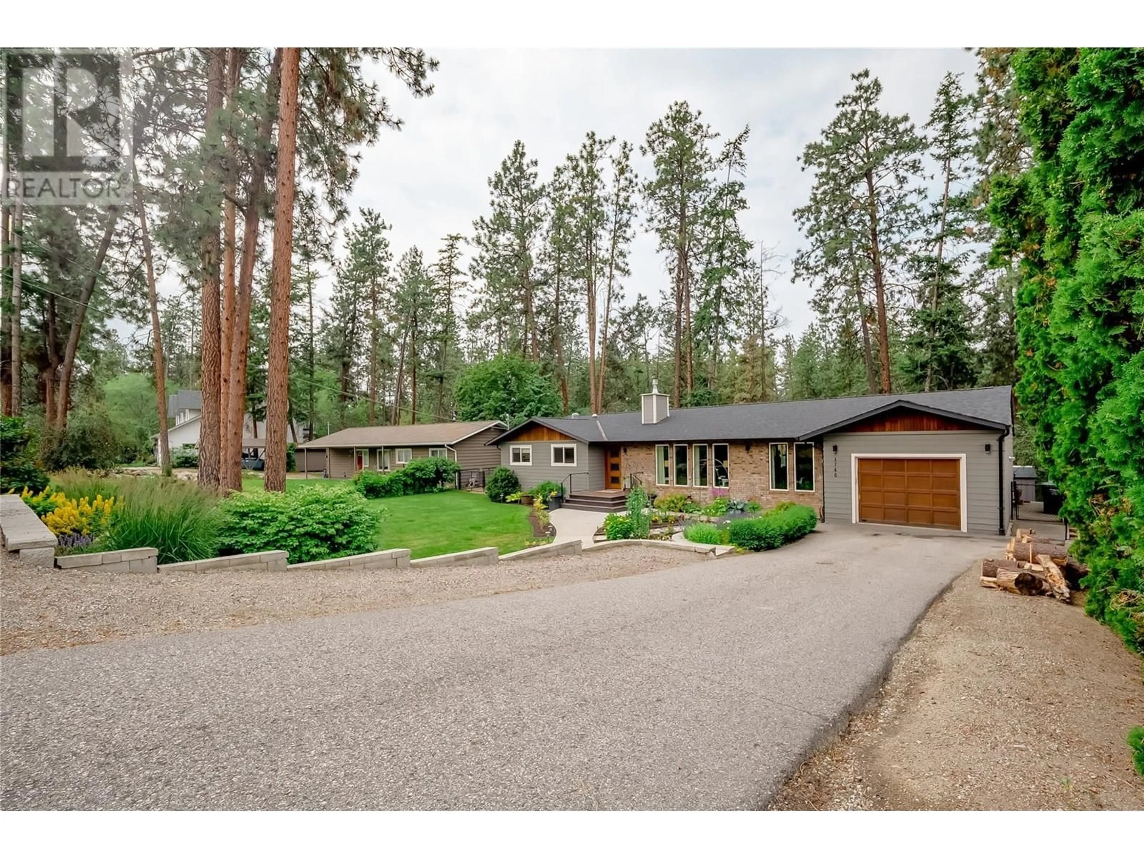 A pic from outside/outdoor area/front of a property/back of a property/a pic from drone, forest/trees view for 1746 LEWIS ROAD, Kelowna British Columbia V1P1E5