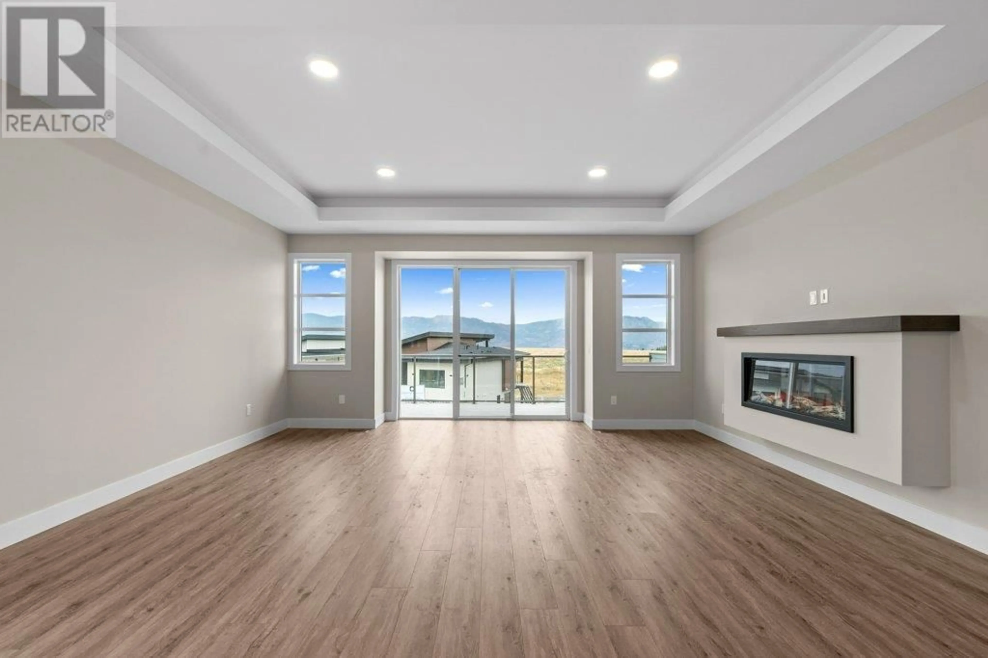 Living room with furniture, wood/laminate floor for 2542 PINNACLE RIDGE DRIVE, West Kelowna British Columbia V4T0E3