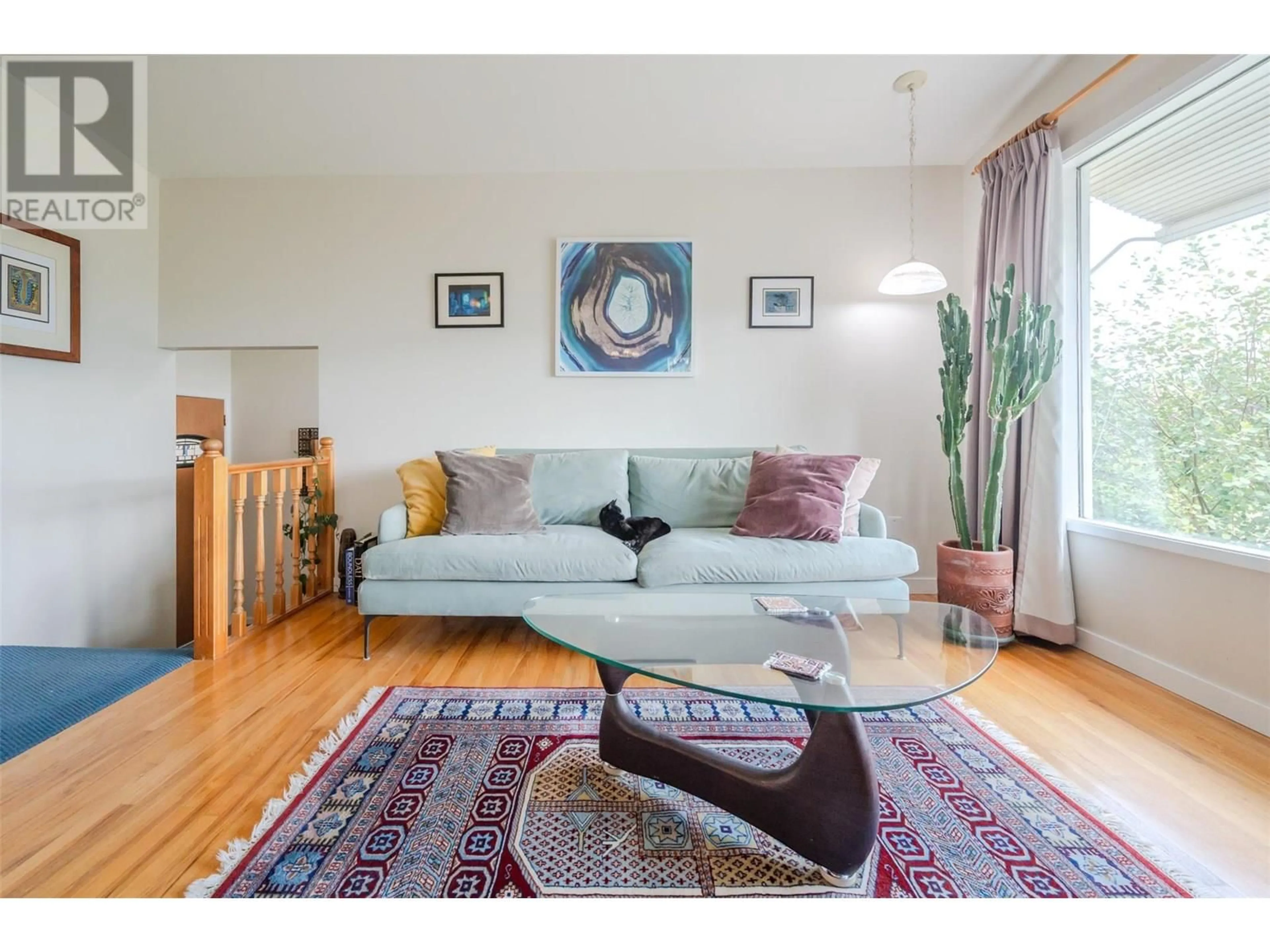 Living room with furniture, wood/laminate floor for 13807 LATIMER AVENUE, Summerland British Columbia V0H1Z1