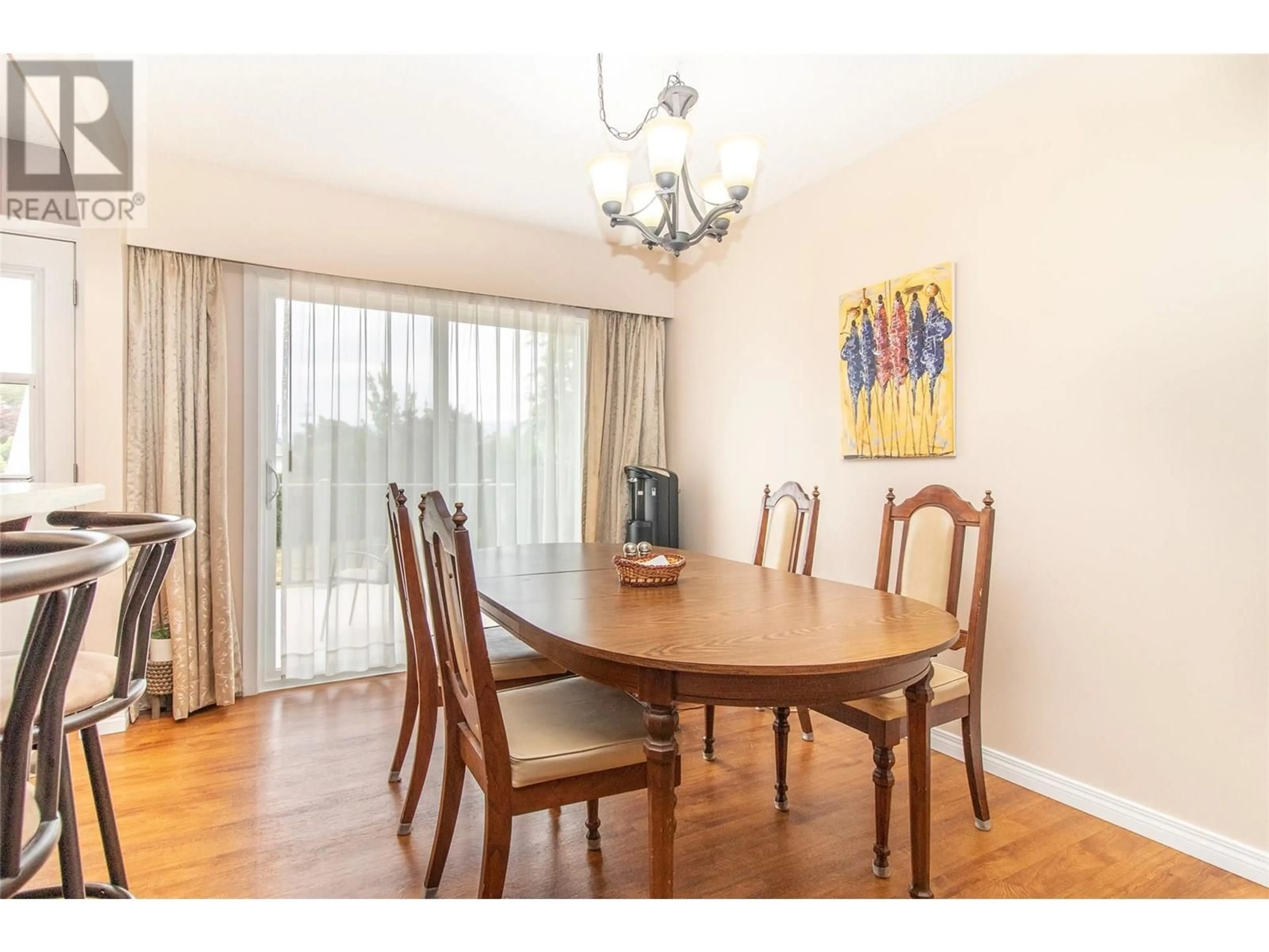 Dining room, wood/laminate floor for 710 TAMARACK DRIVE, Kelowna British Columbia V1X5L9