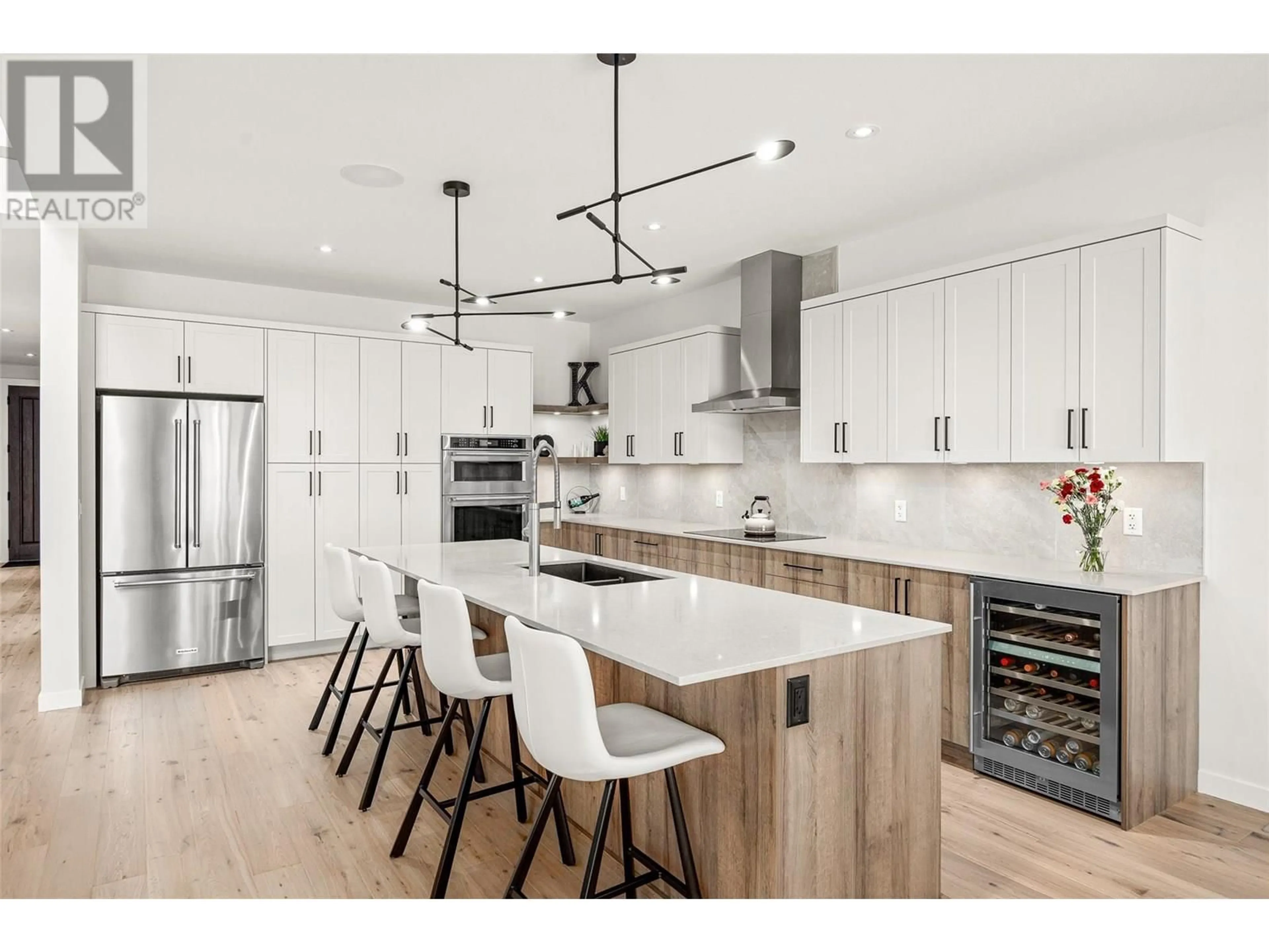 Open concept kitchen, wood/laminate floor for 162 ECHO RIDGE DRIVE, Kelowna British Columbia V1V0C9