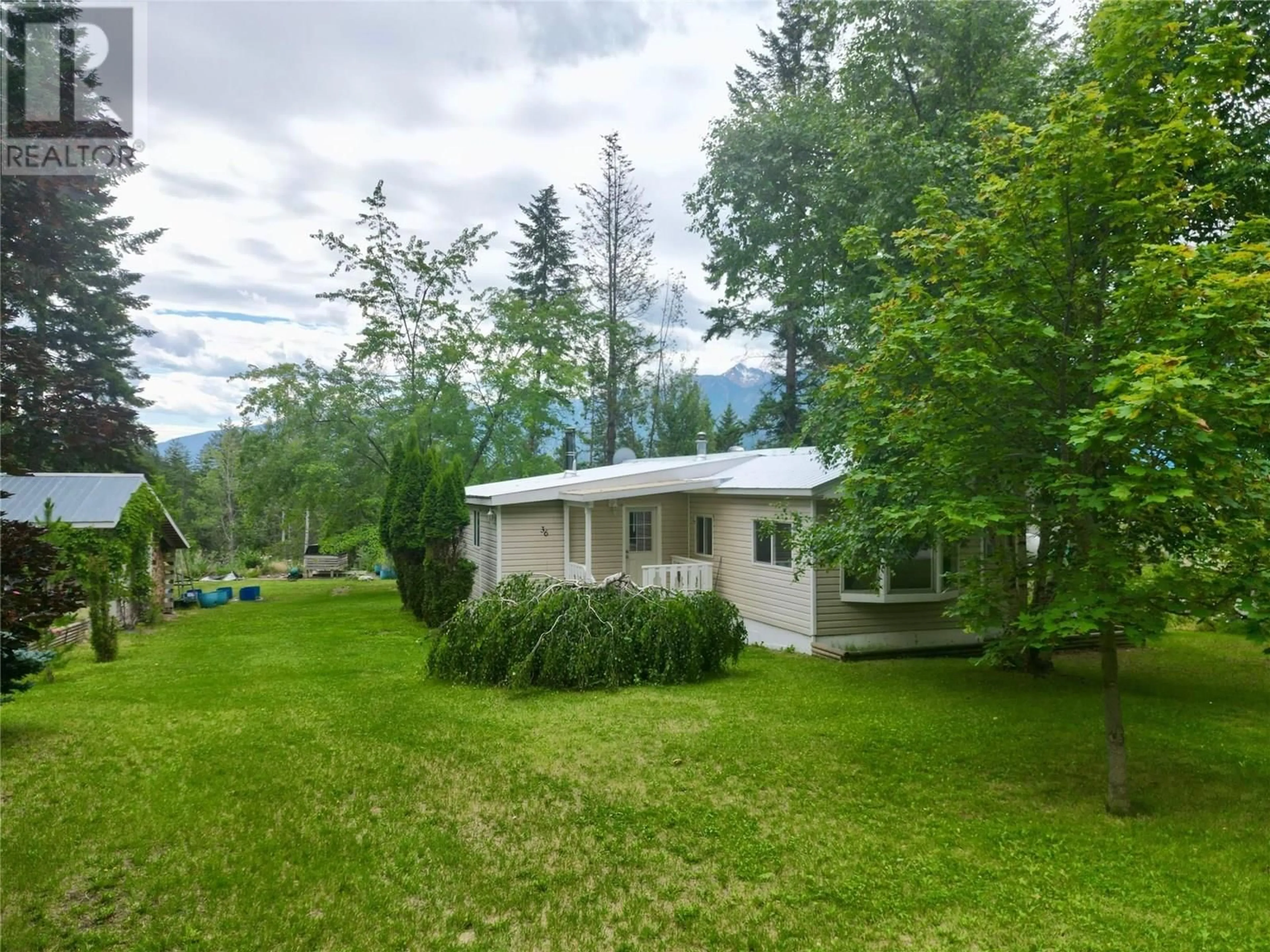 A pic from outside/outdoor area/front of a property/back of a property/a pic from drone, mountain view for 36 - 470 REFLECTION LAKE ROAD, Golden British Columbia V0A1H6