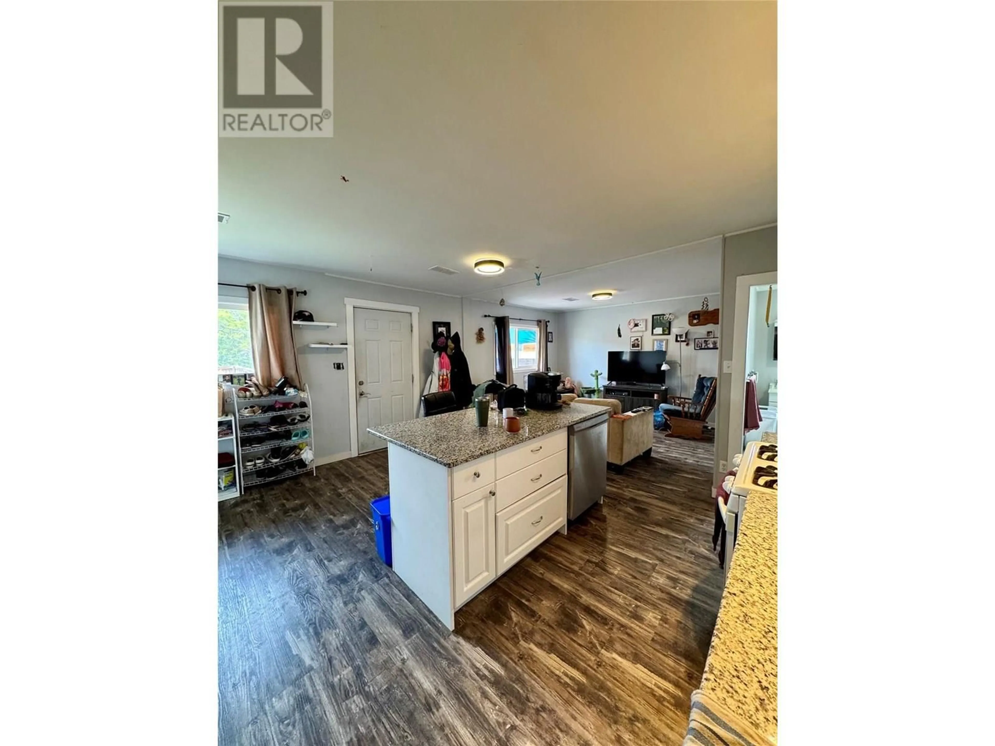 Open concept kitchen, wood/laminate floor for 2276 COUTLEE AVENUE, Merritt British Columbia V1K1R6