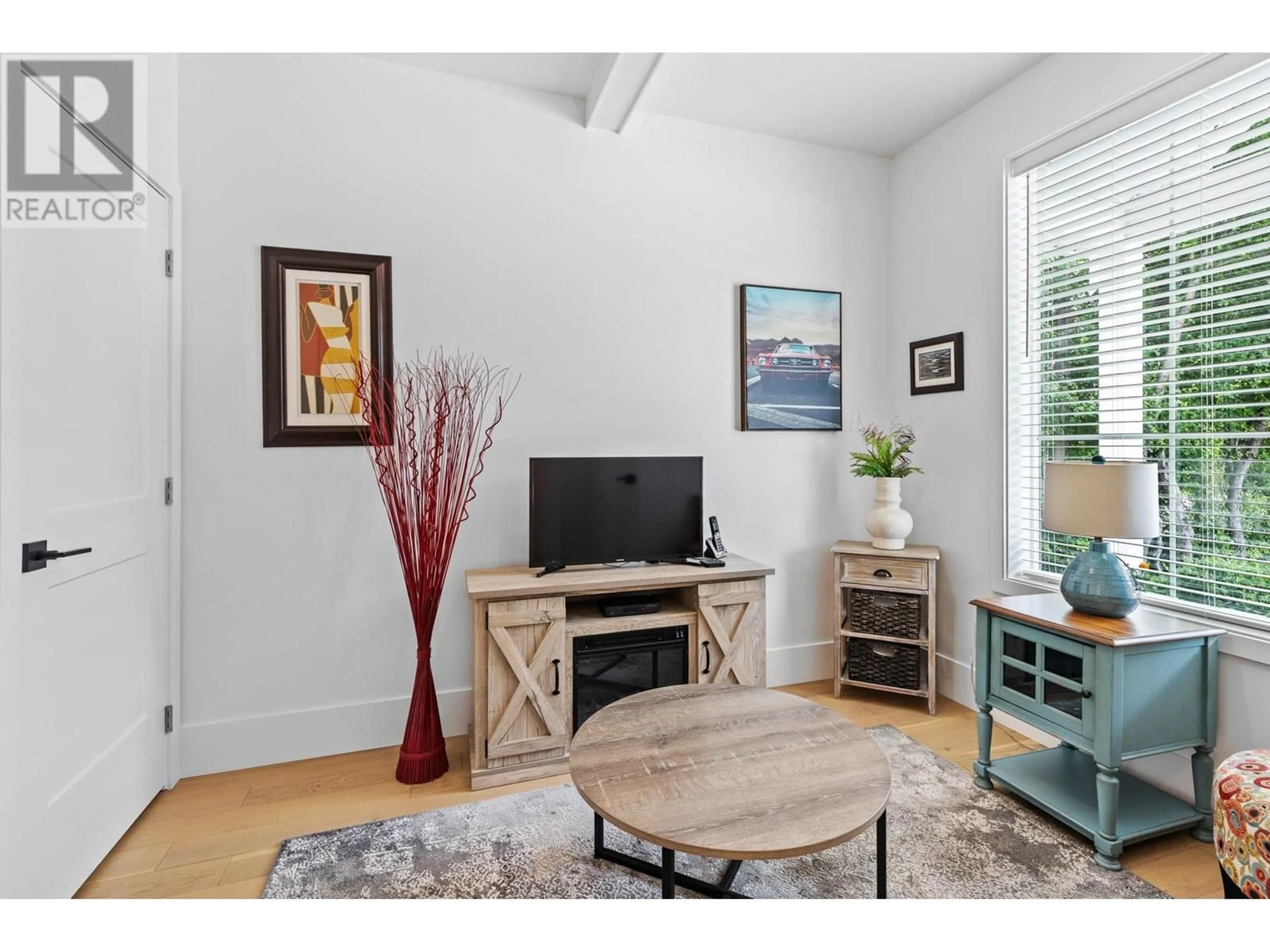 Living room with furniture, wood/laminate floor for 5720 CENTURY STREET, Summerland British Columbia V0H1Z1