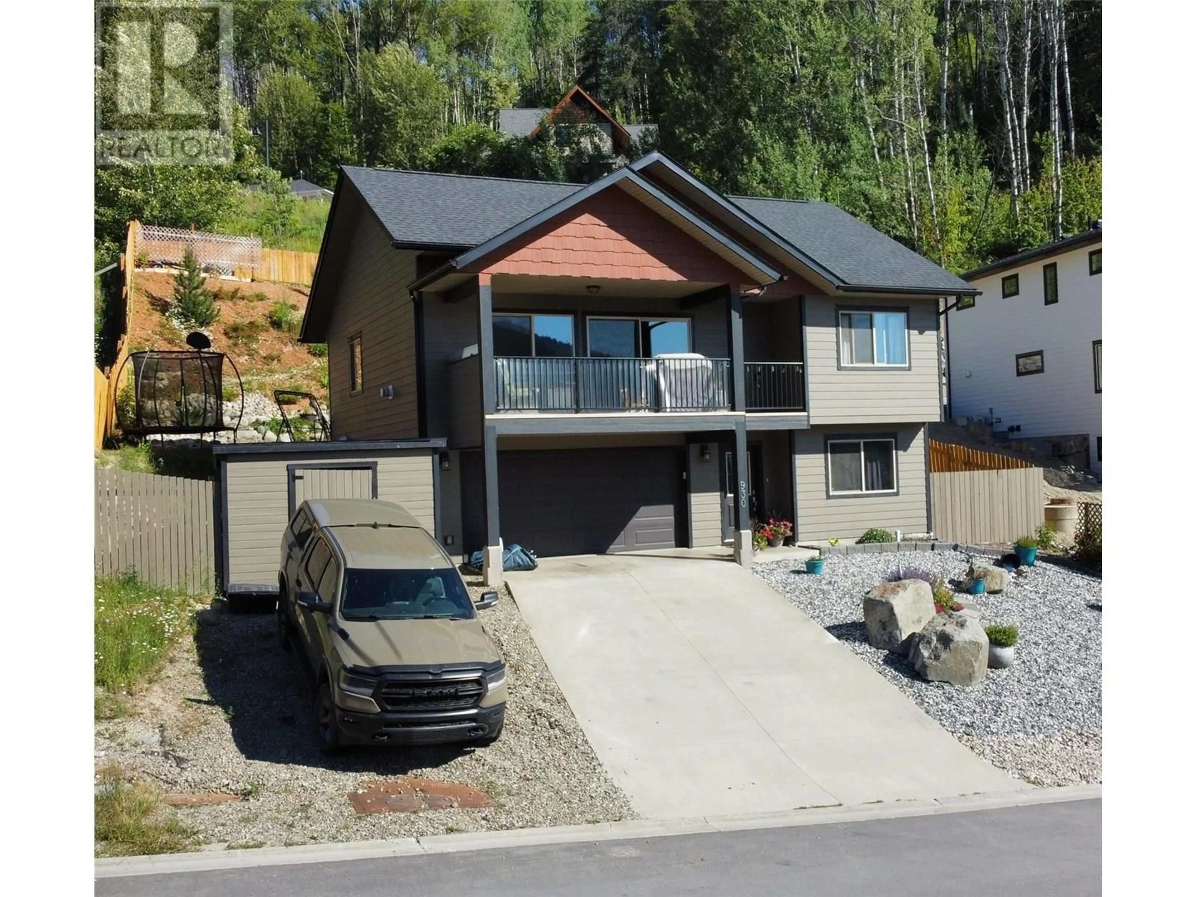 Home with vinyl exterior material, street for 930 REDSTONE DRIVE, Rossland British Columbia V0G1Y0