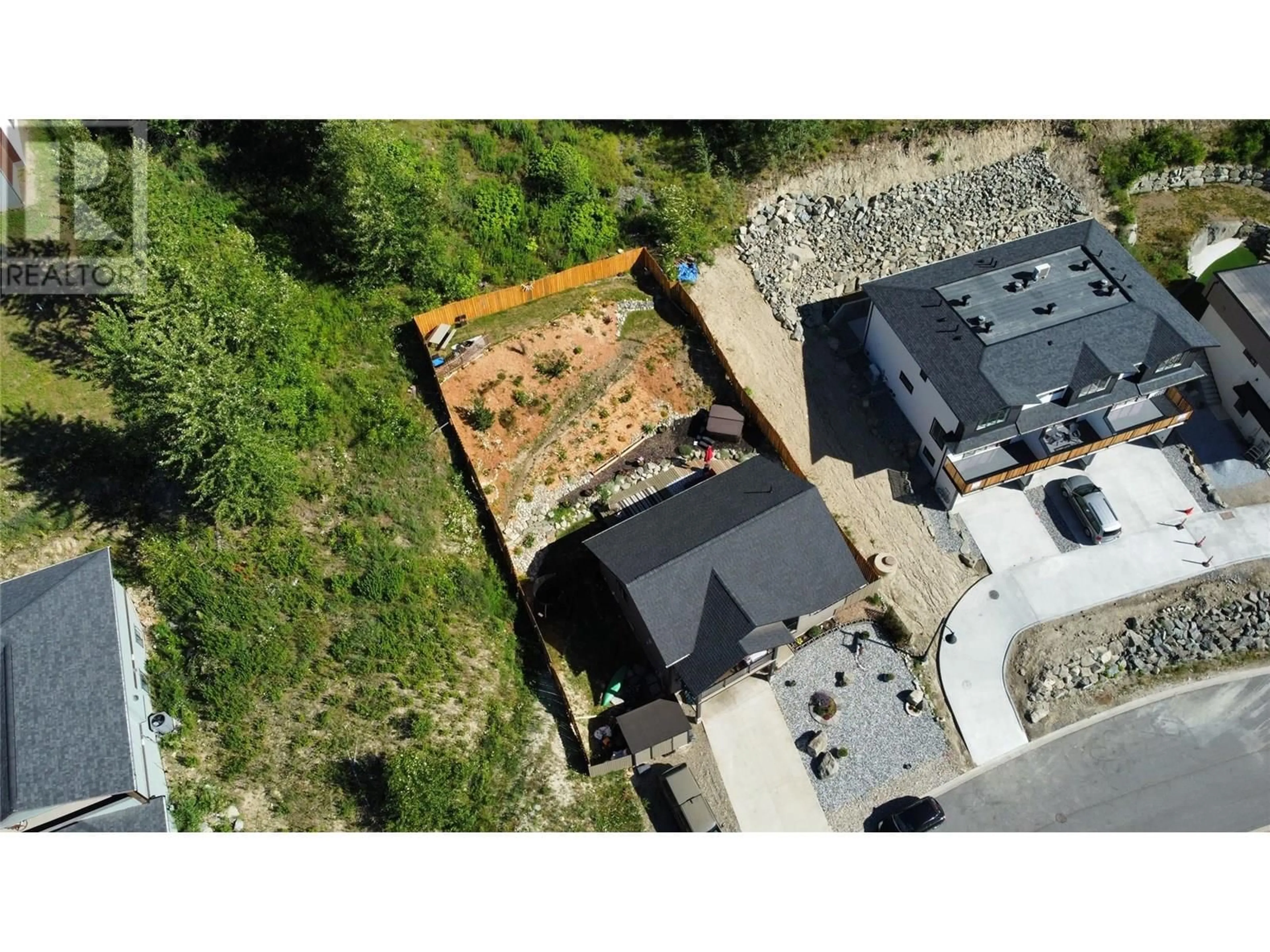A pic from outside/outdoor area/front of a property/back of a property/a pic from drone, unknown for 930 REDSTONE DRIVE, Rossland British Columbia V0G1Y0