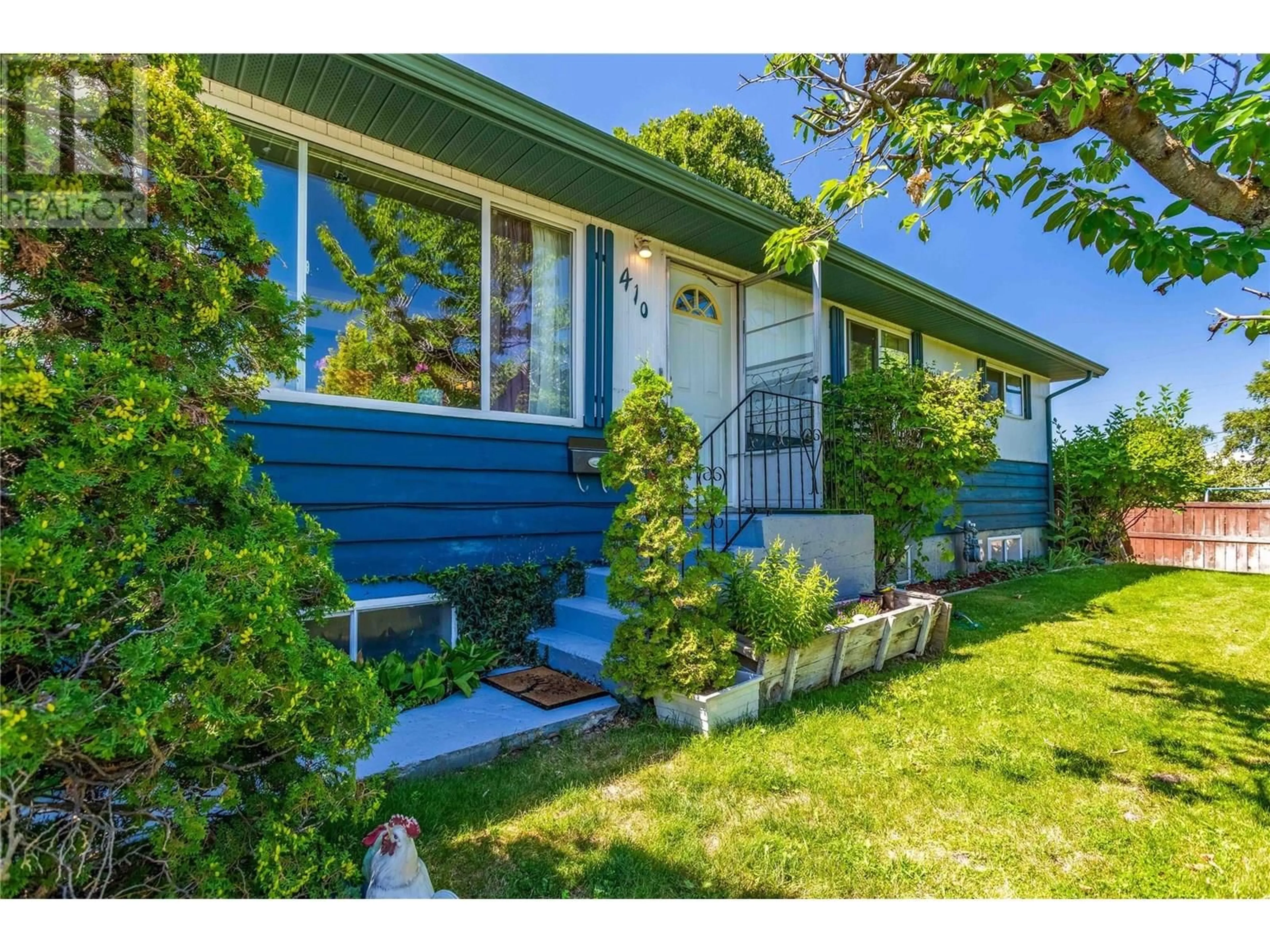 Home with vinyl exterior material, street for 410 DAVIE ROAD, Kelowna British Columbia V1X3Z1