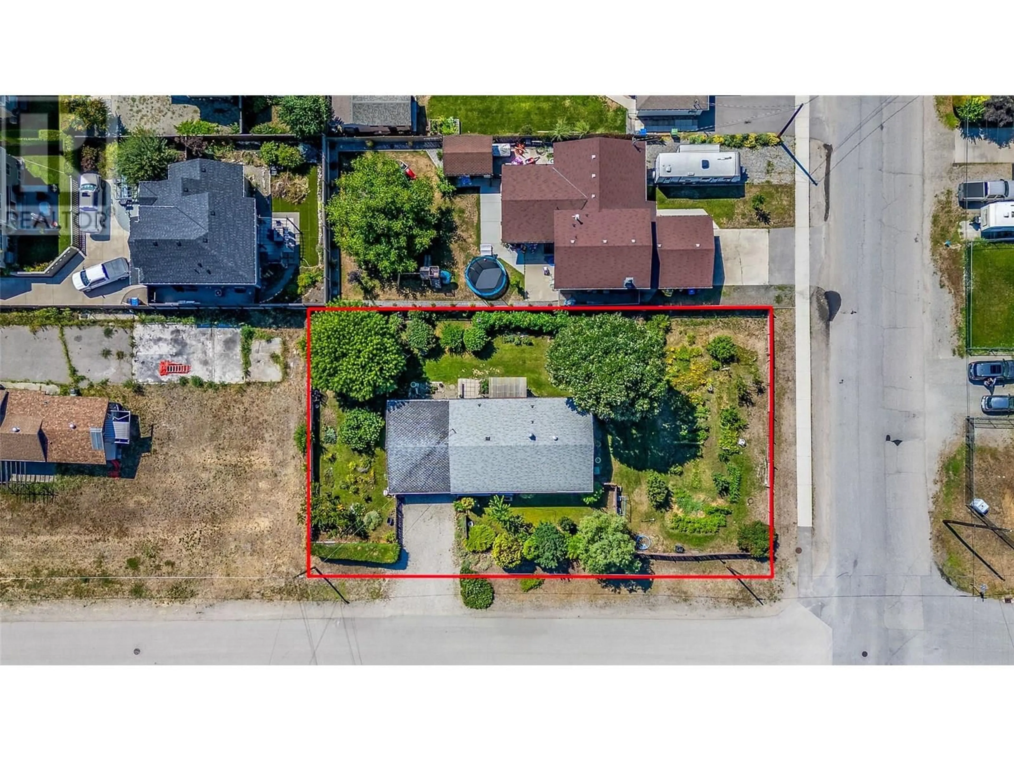 A pic from outside/outdoor area/front of a property/back of a property/a pic from drone, street for 410 DAVIE ROAD, Kelowna British Columbia V1X3Z1