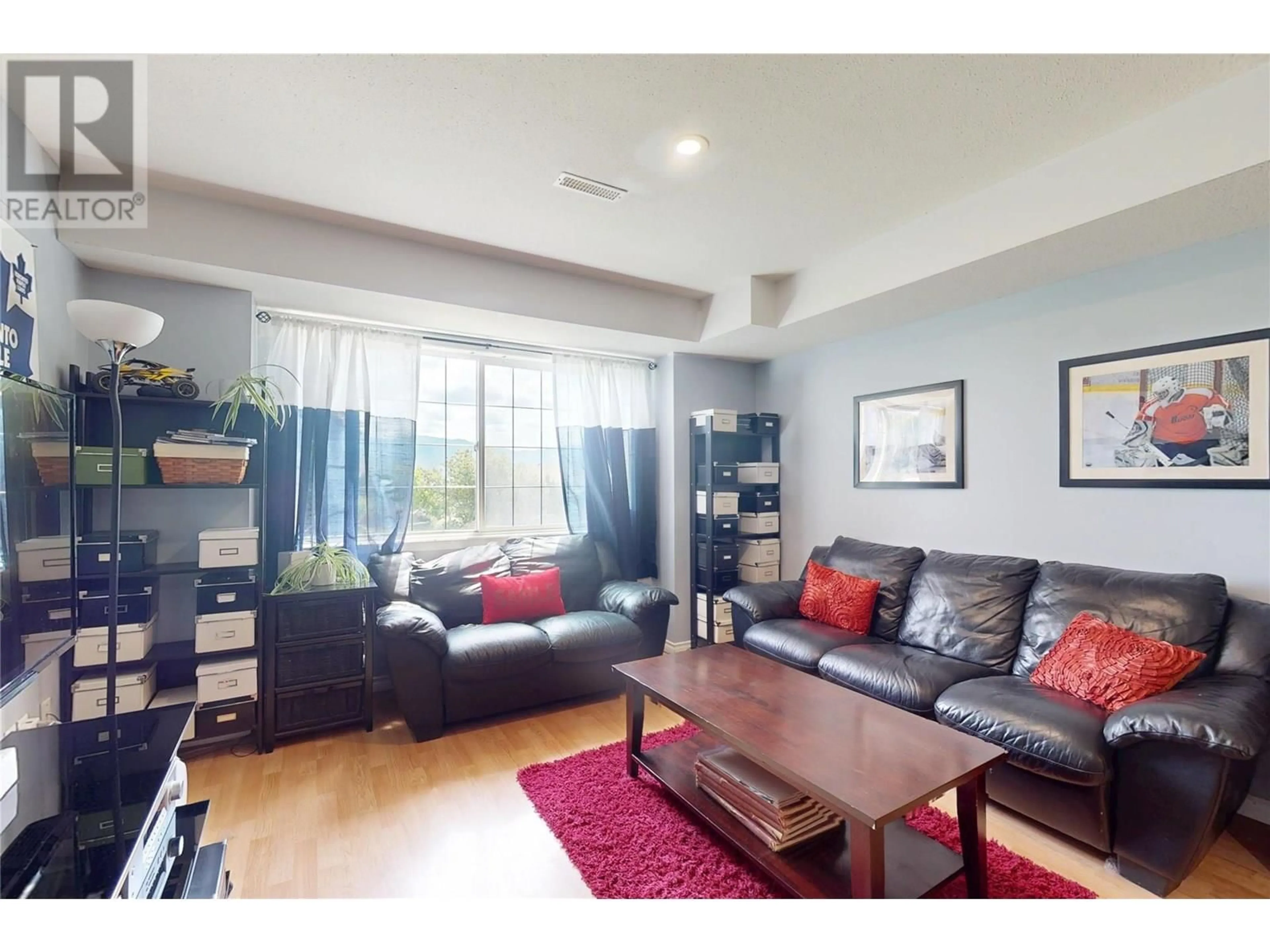 Living room with furniture, wood/laminate floor for 314 - 2440 OLD OKANAGAN HIGHWAY, West Kelowna British Columbia V4T1X6