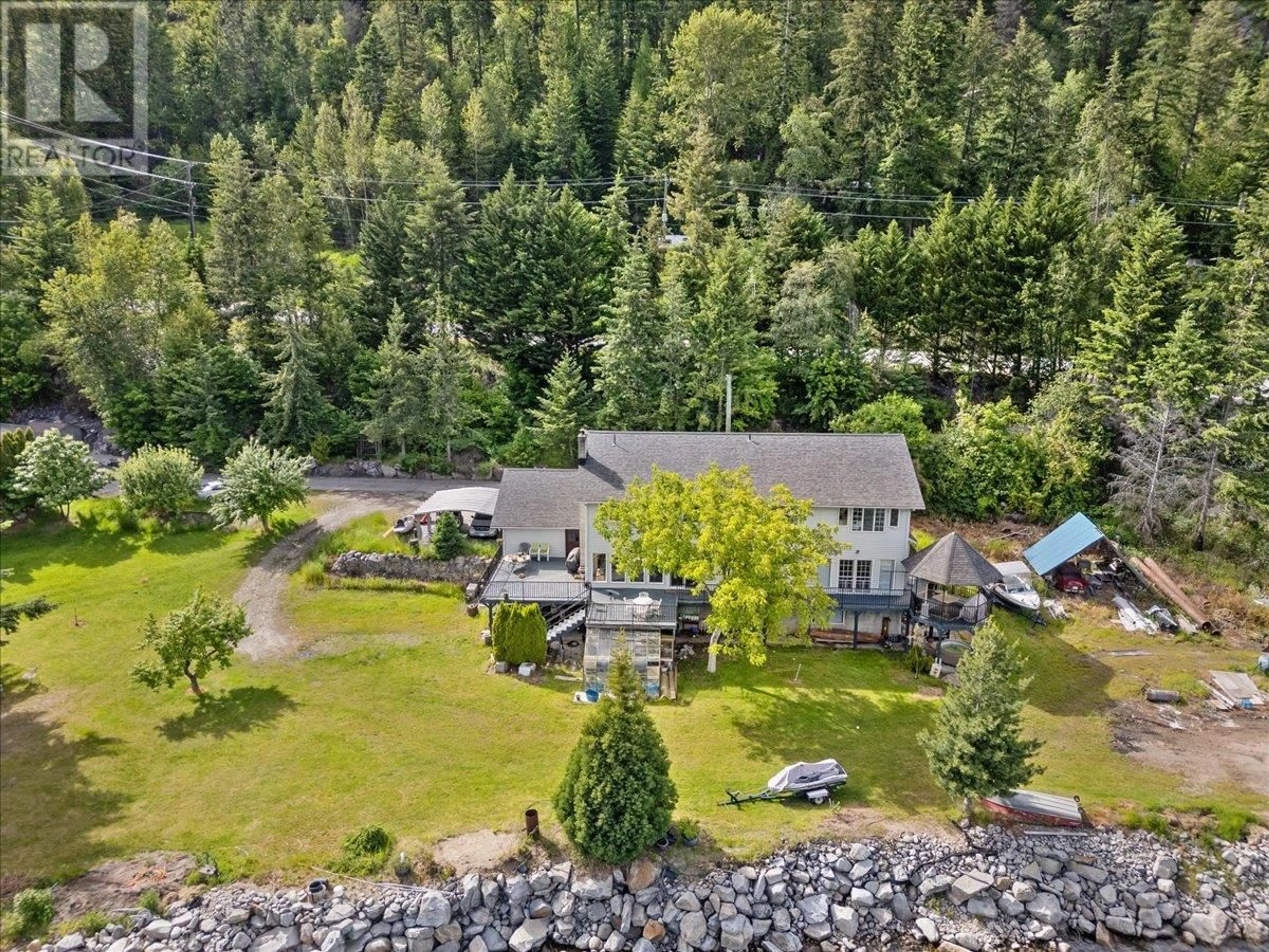 A pic from outside/outdoor area/front of a property/back of a property/a pic from drone, water/lake/river/ocean view for 1089, 1090 3A HIGHWAY, Nelson British Columbia V1L6J5