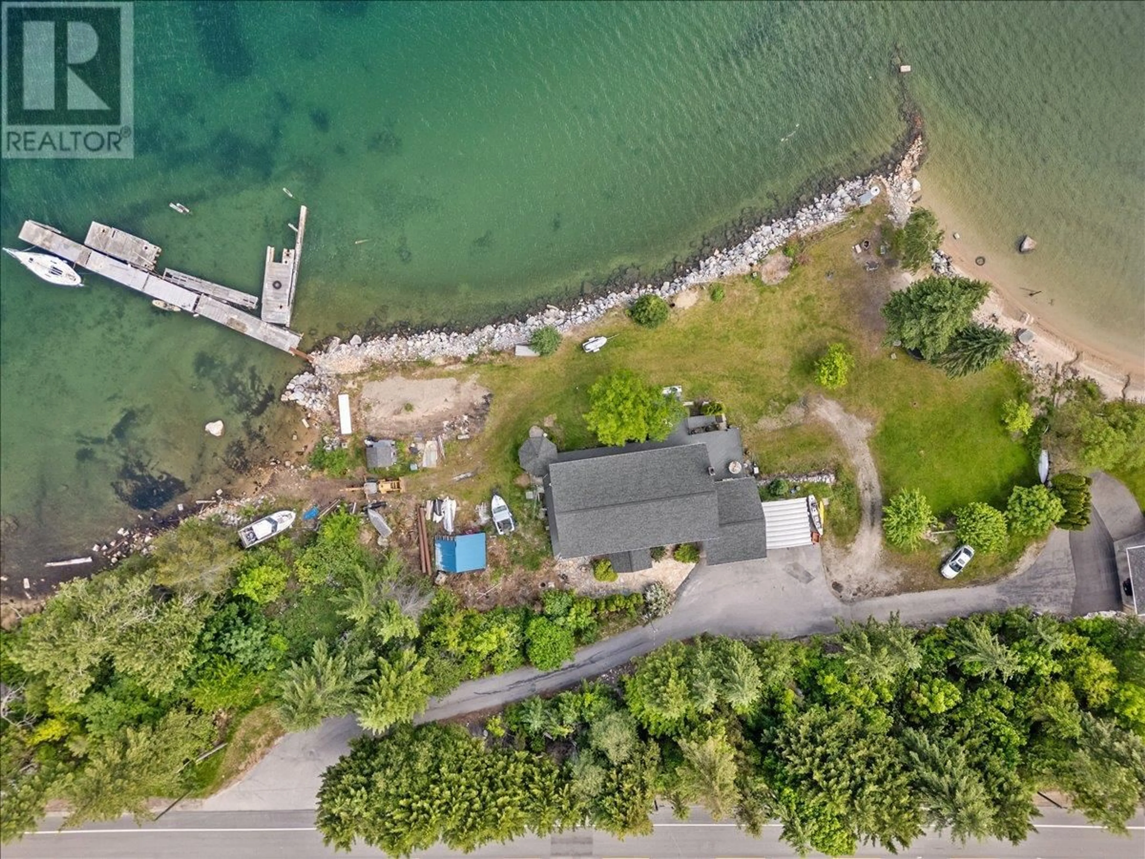 A pic from outside/outdoor area/front of a property/back of a property/a pic from drone, water/lake/river/ocean view for 1089, 1090 3A HIGHWAY, Nelson British Columbia V1L6J5