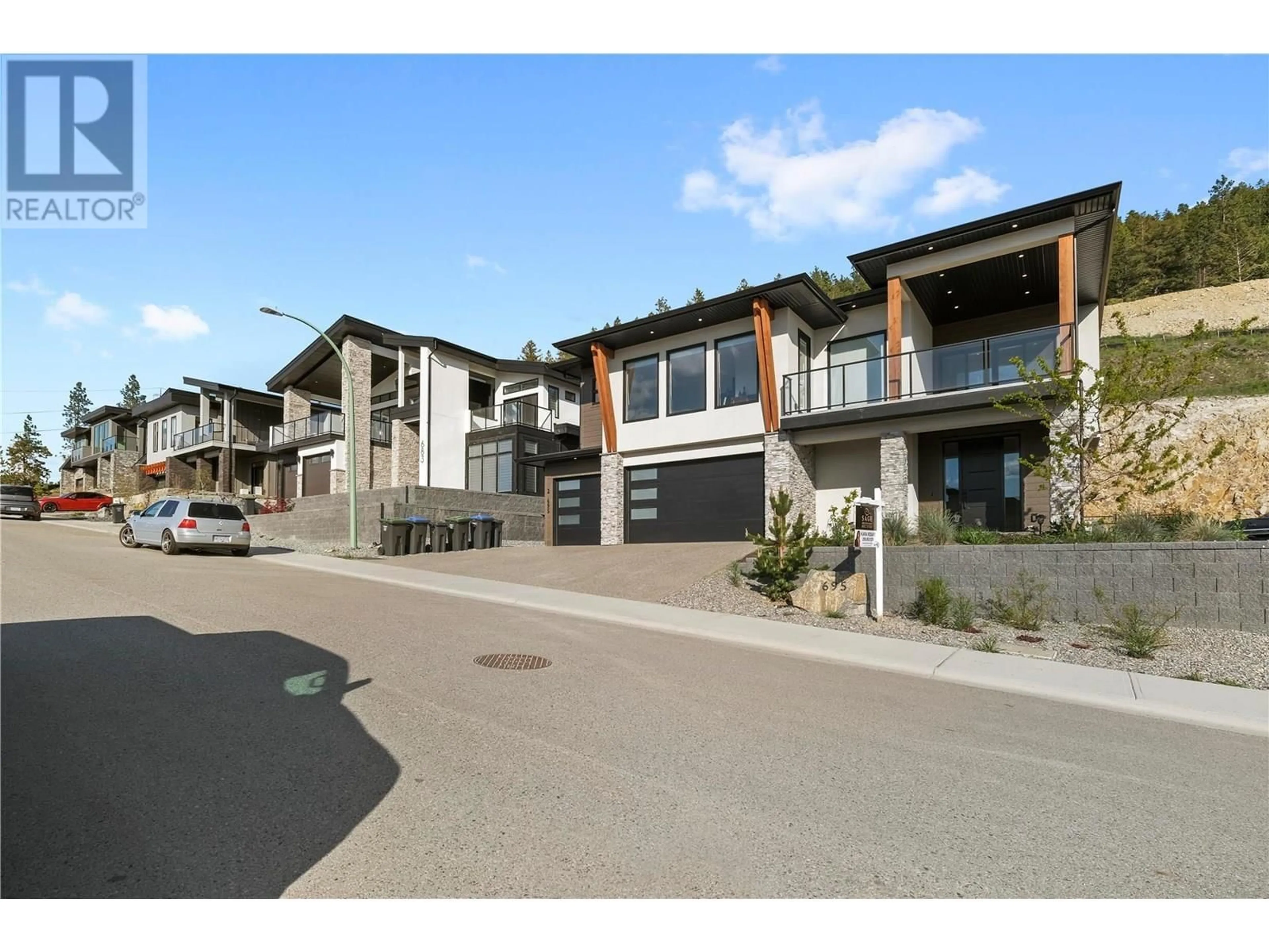A pic from outside/outdoor area/front of a property/back of a property/a pic from drone, street for 695 DEANS DRIVE, Kelowna British Columbia V1P1A1