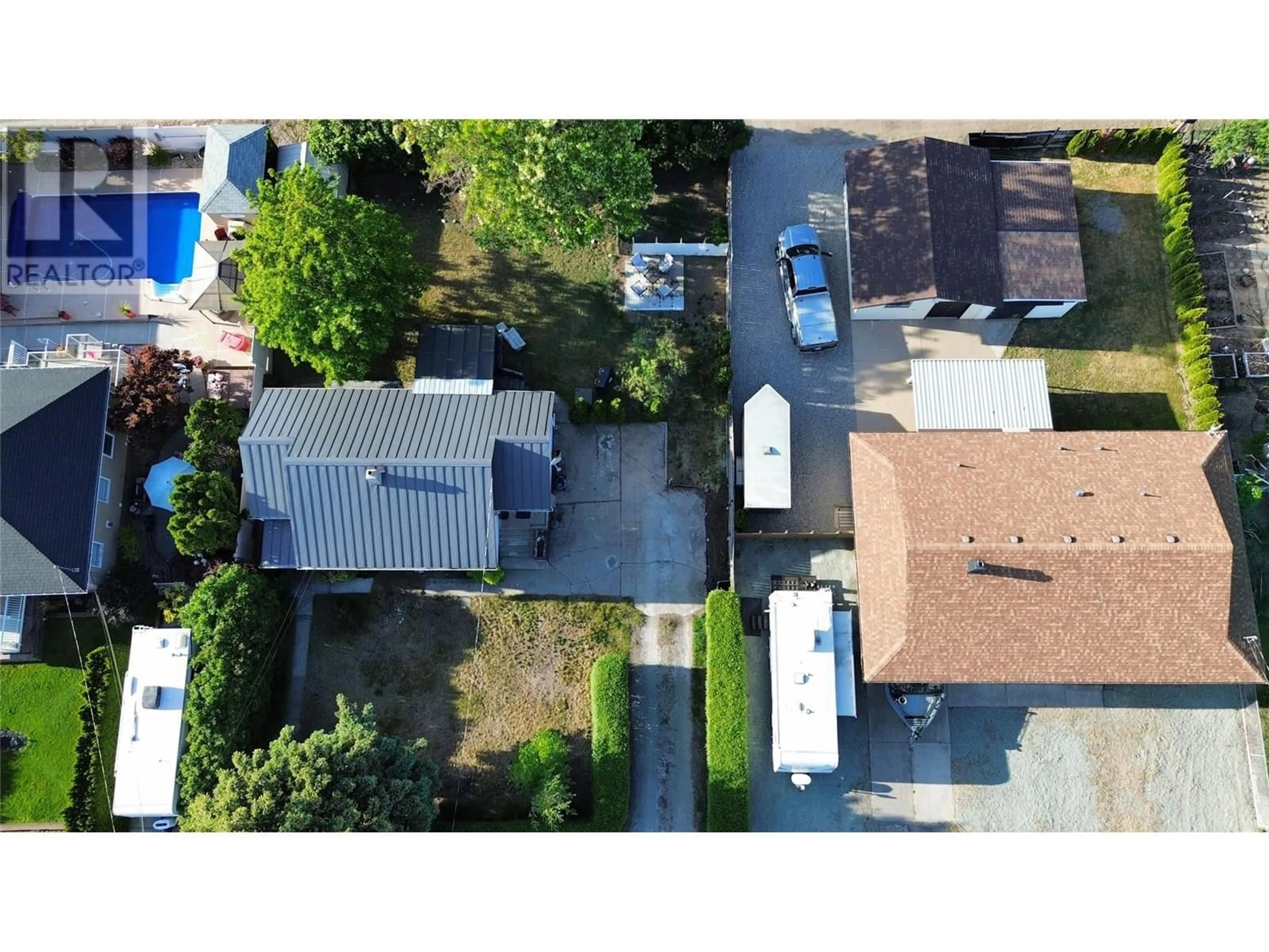 A pic from outside/outdoor area/front of a property/back of a property/a pic from drone, street for 5506 JACKPINE LANE, Osoyoos British Columbia V0H1V3