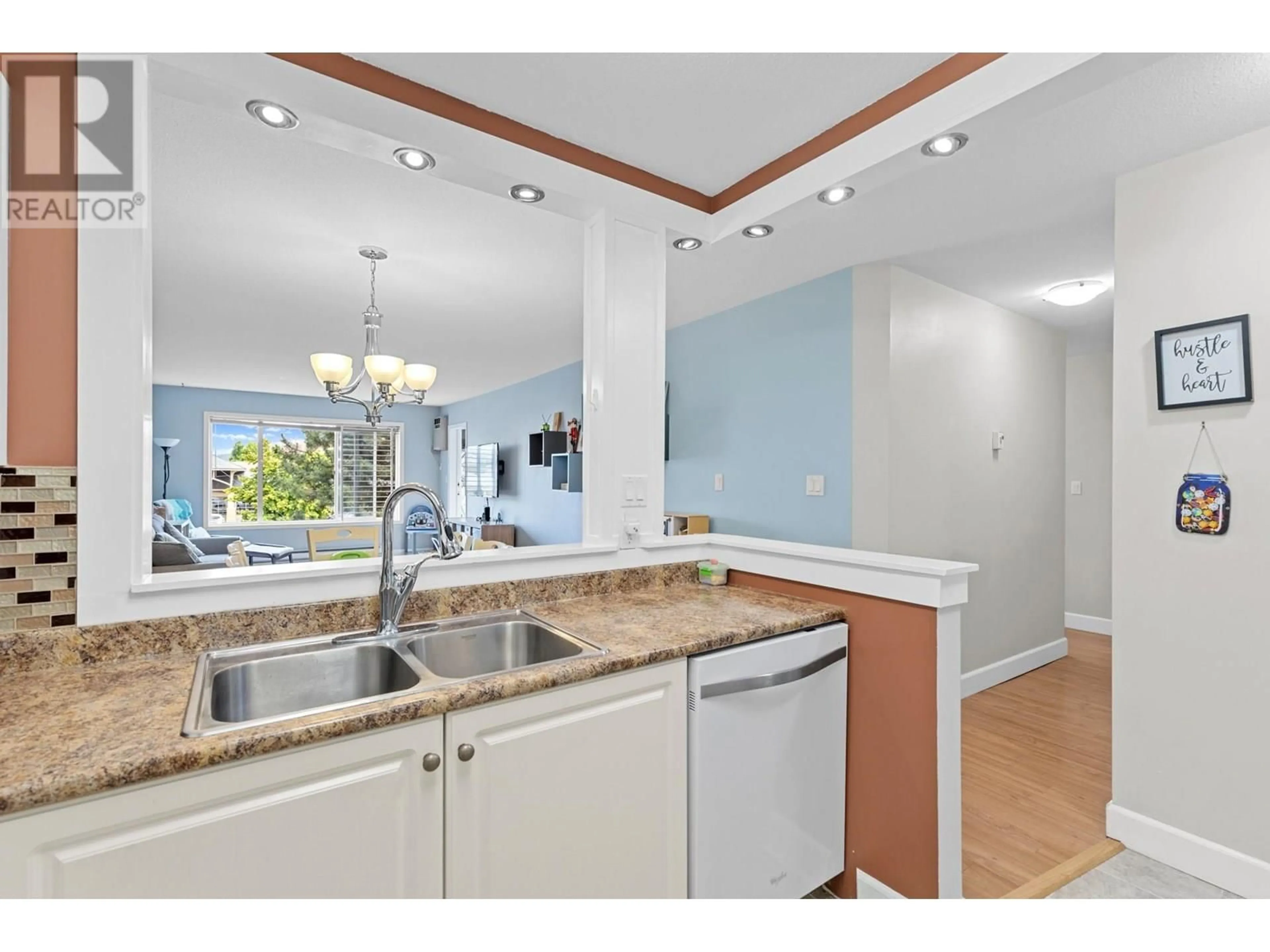 Open concept kitchen, ceramic/tile floor for 209 - 400 SUTTON CRESCENT, Kelowna British Columbia V1Y1Y3