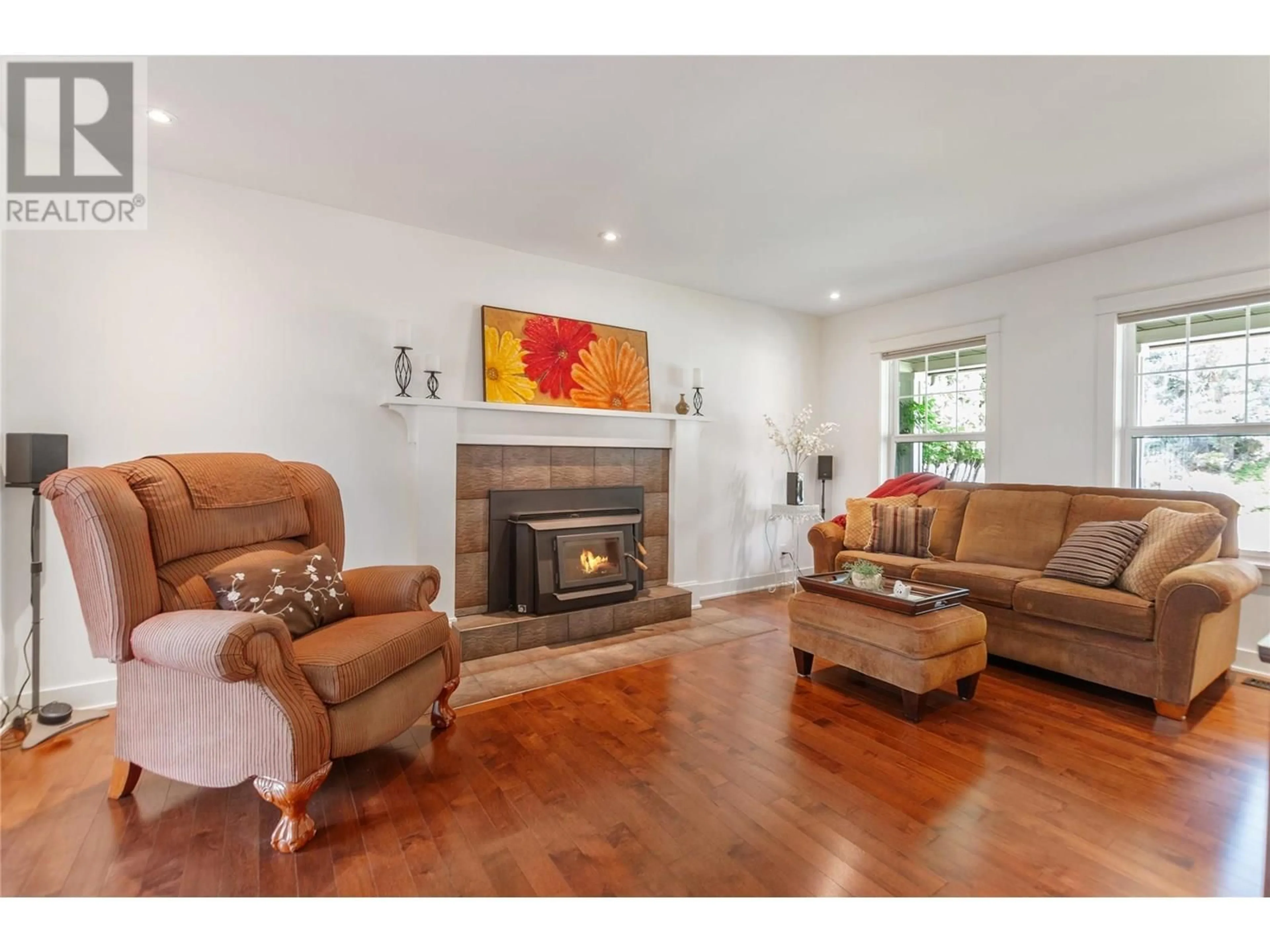 Living room with furniture, wood/laminate floor for 2687 EVERGREEN DRIVE, Penticton British Columbia V2A7Y3