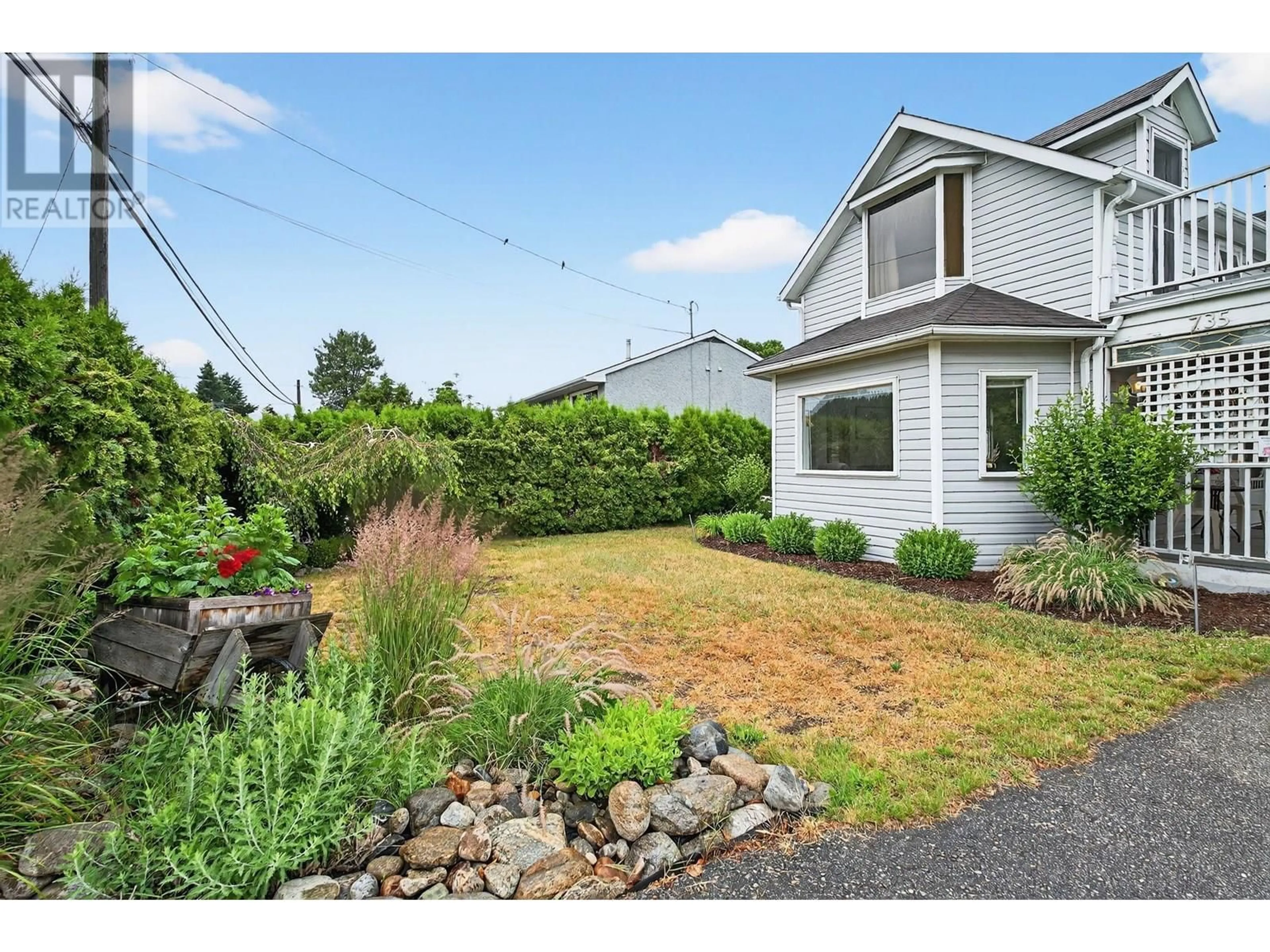 A pic from outside/outdoor area/front of a property/back of a property/a pic from drone, street for 735 ROBINSON AVENUE, Naramata British Columbia V0H1N0