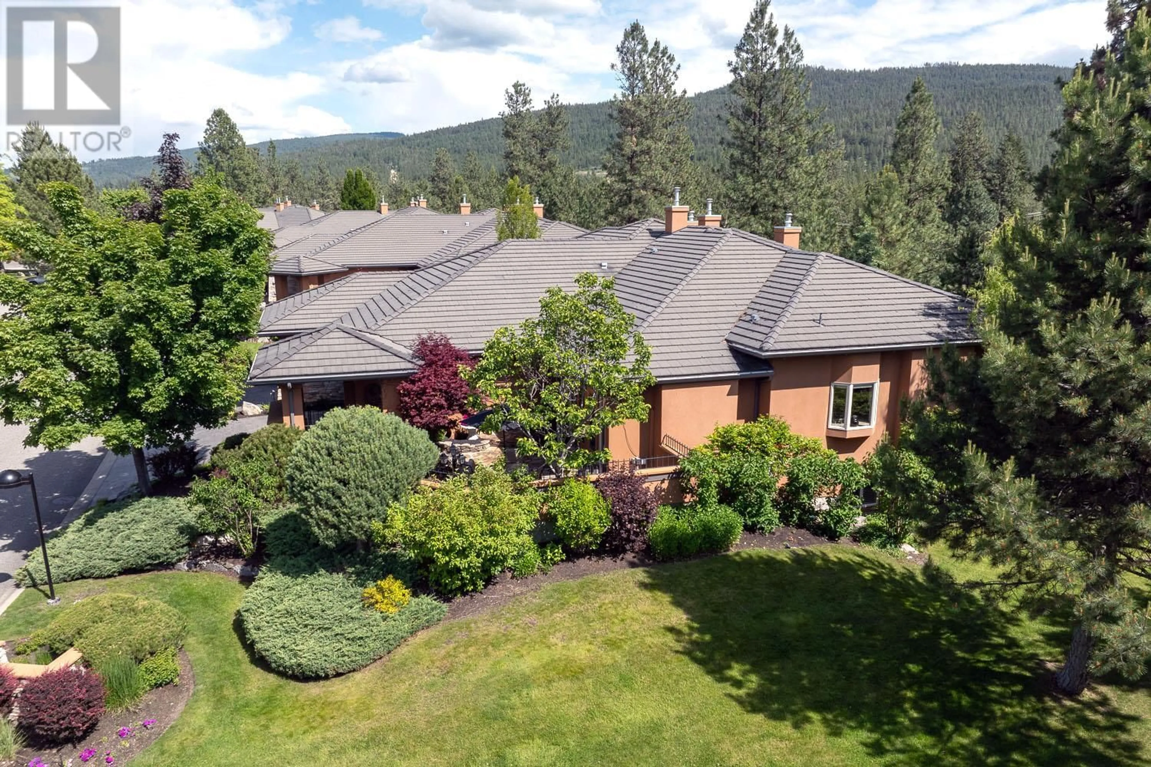 A pic from outside/outdoor area/front of a property/back of a property/a pic from drone, mountain view for 18 - 4100 GALLAGHERS PARKLAND DRIVE, Kelowna British Columbia V1W3Z8
