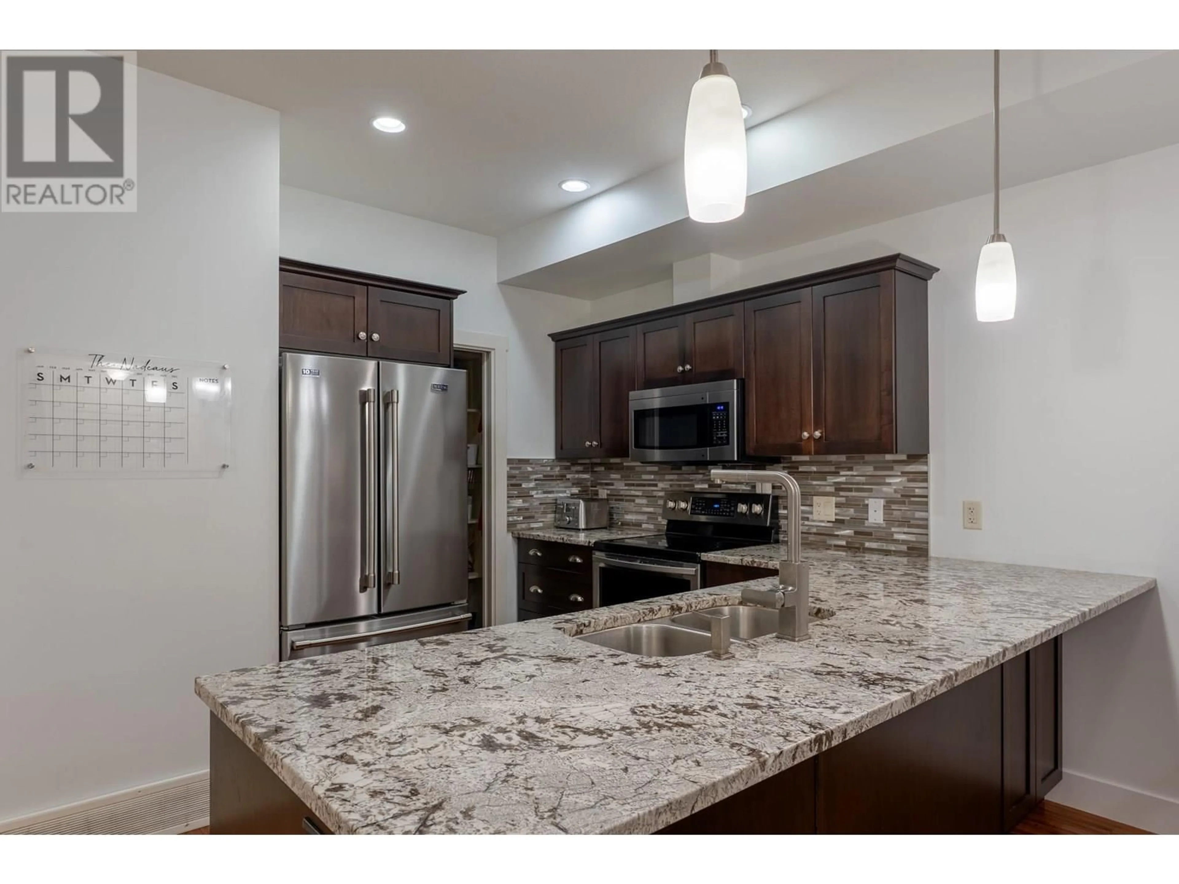 Open concept kitchen, ceramic/tile floor for 2 - 600 BOYNTON PLACE, Kelowna British Columbia V1V3B8