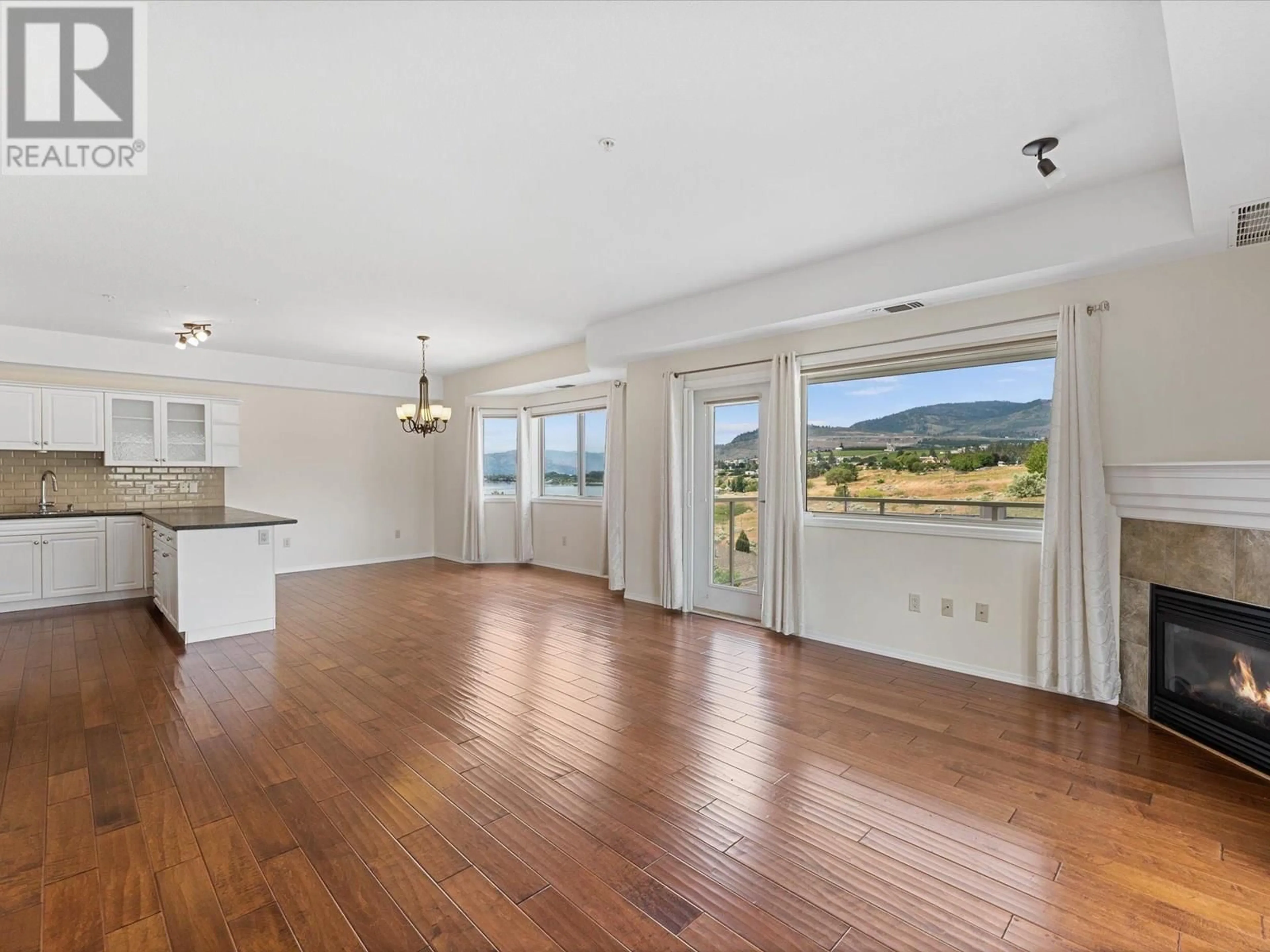 Open concept kitchen, wood/laminate floor for 202 - 2100 BOUCHERIE ROAD, West Kelowna British Columbia V4T2X1
