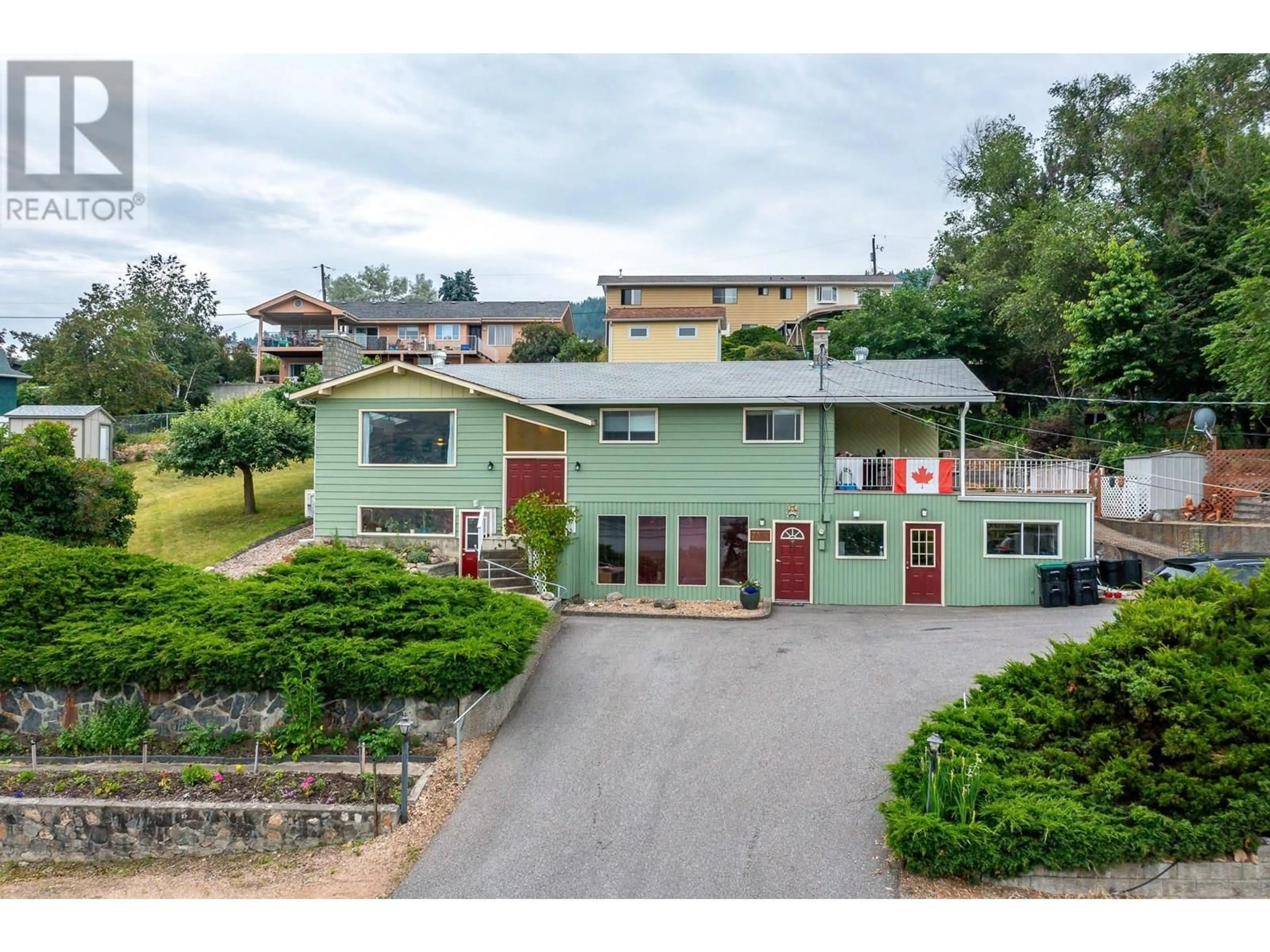 A pic from outside/outdoor area/front of a property/back of a property/a pic from drone, unknown for 7393 LONGACRE DRIVE, Vernon British Columbia V1H1R5