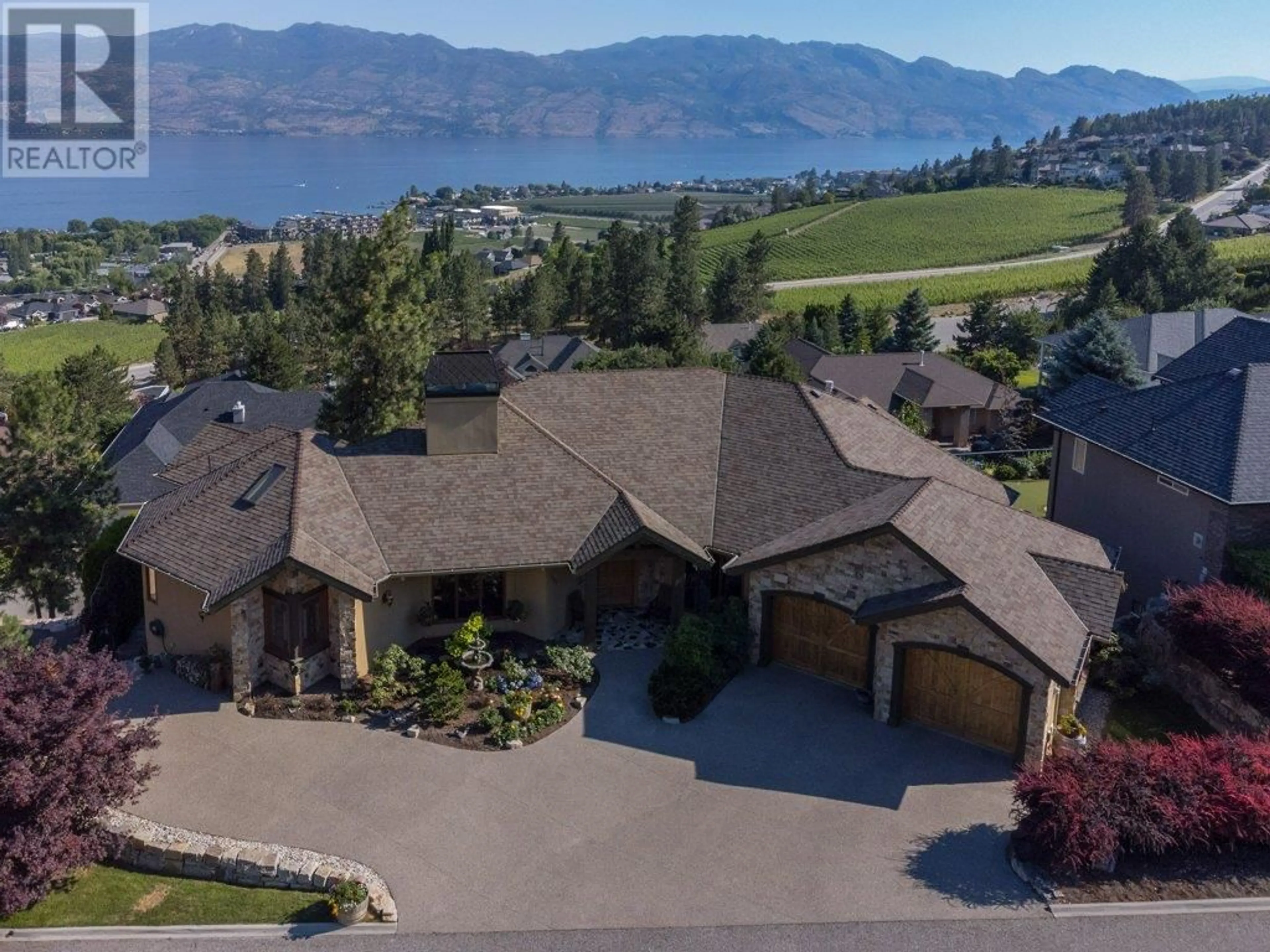 A pic from outside/outdoor area/front of a property/back of a property/a pic from drone, mountain view for 1555 GREGORY ROAD, West Kelowna British Columbia V4T2V7