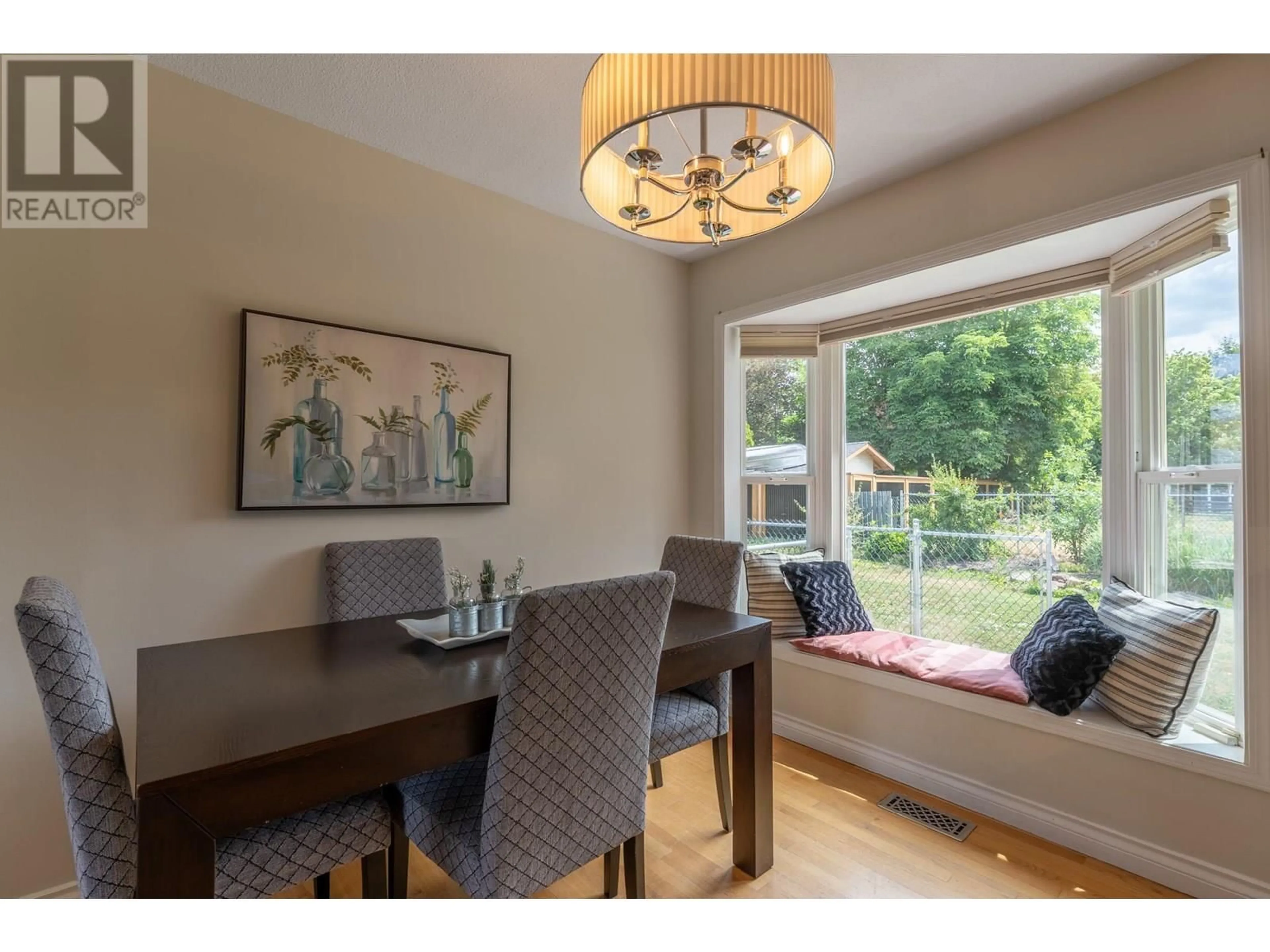 Dining room, wood/laminate floor for 405 MACADEN COURT, Kelowna British Columbia V1X2V1