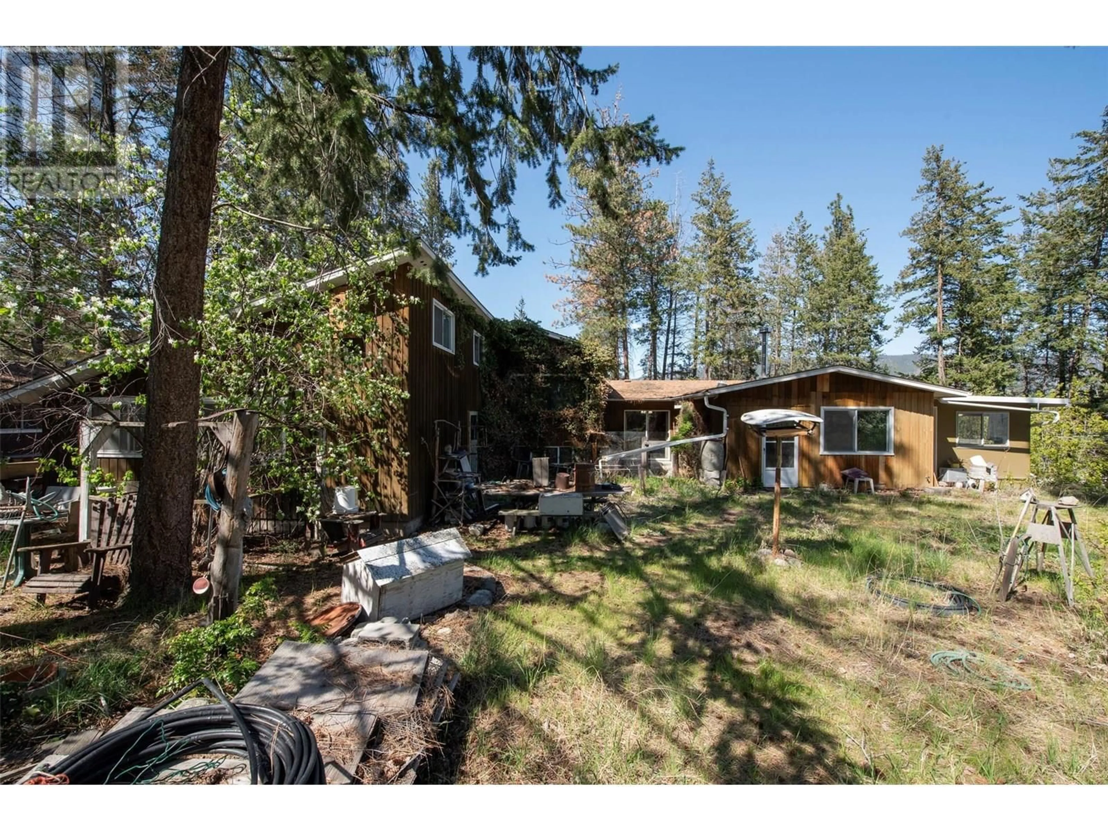 A pic from outside/outdoor area/front of a property/back of a property/a pic from drone, forest/trees view for 3021 MCIVER ROAD, West Kelowna British Columbia V4T1C4