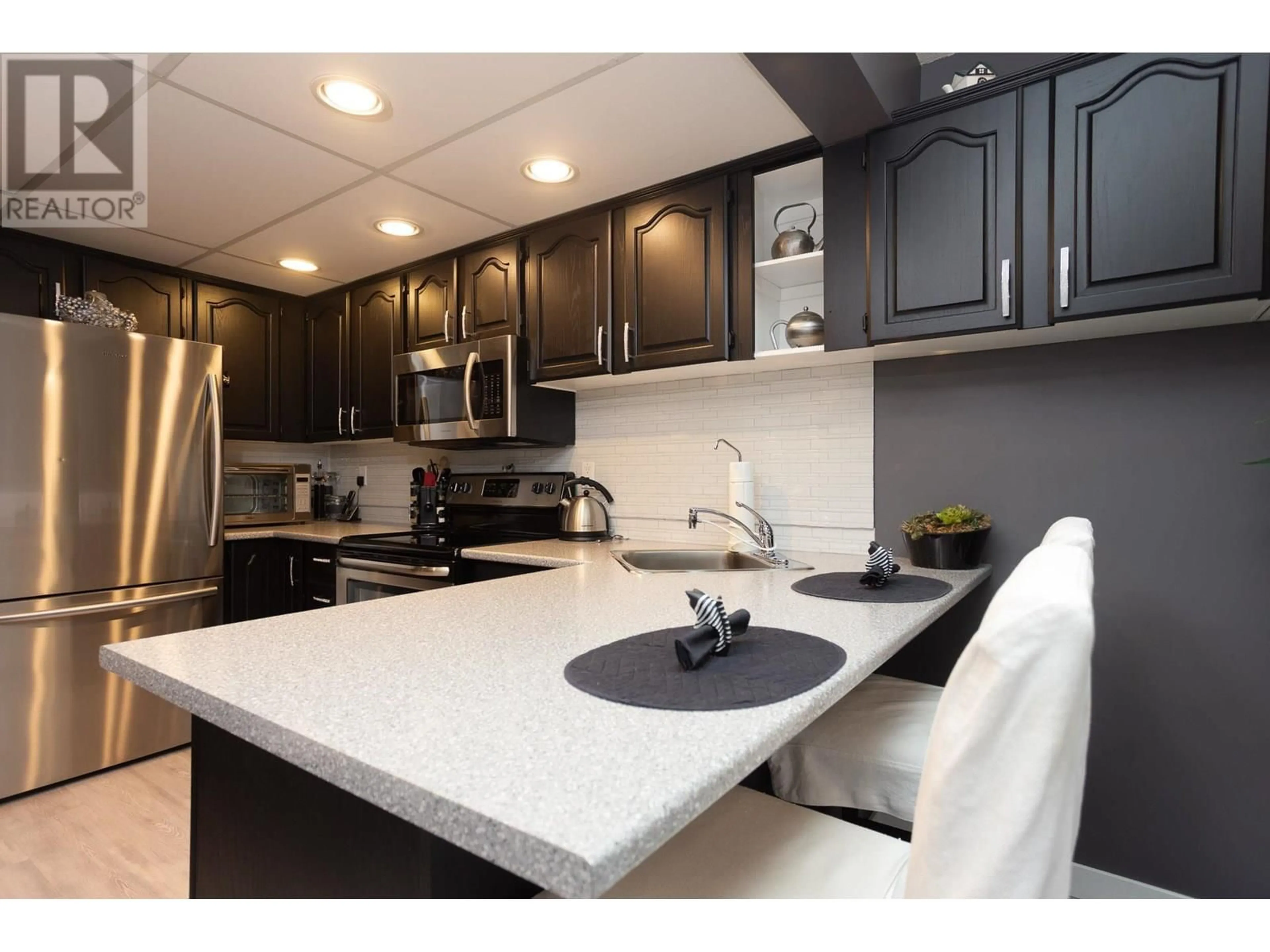 Open concept kitchen, ceramic/tile floor for 27 - 1950 BURTCH ROAD, Kelowna British Columbia V1Y4B2