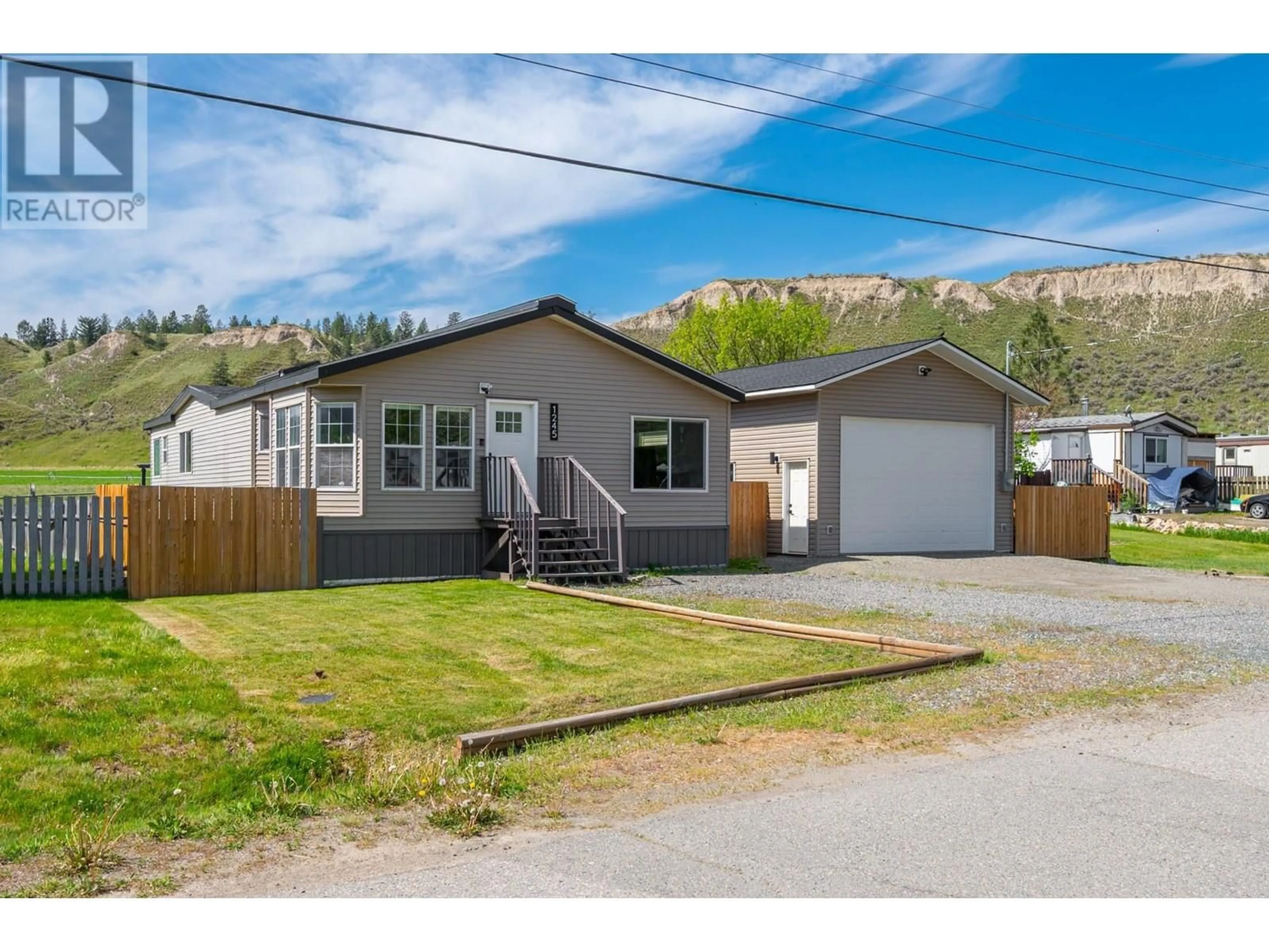 Home with vinyl exterior material, street for 1245 DECAMILLIS ROAD, Kamloops British Columbia V0E2P0
