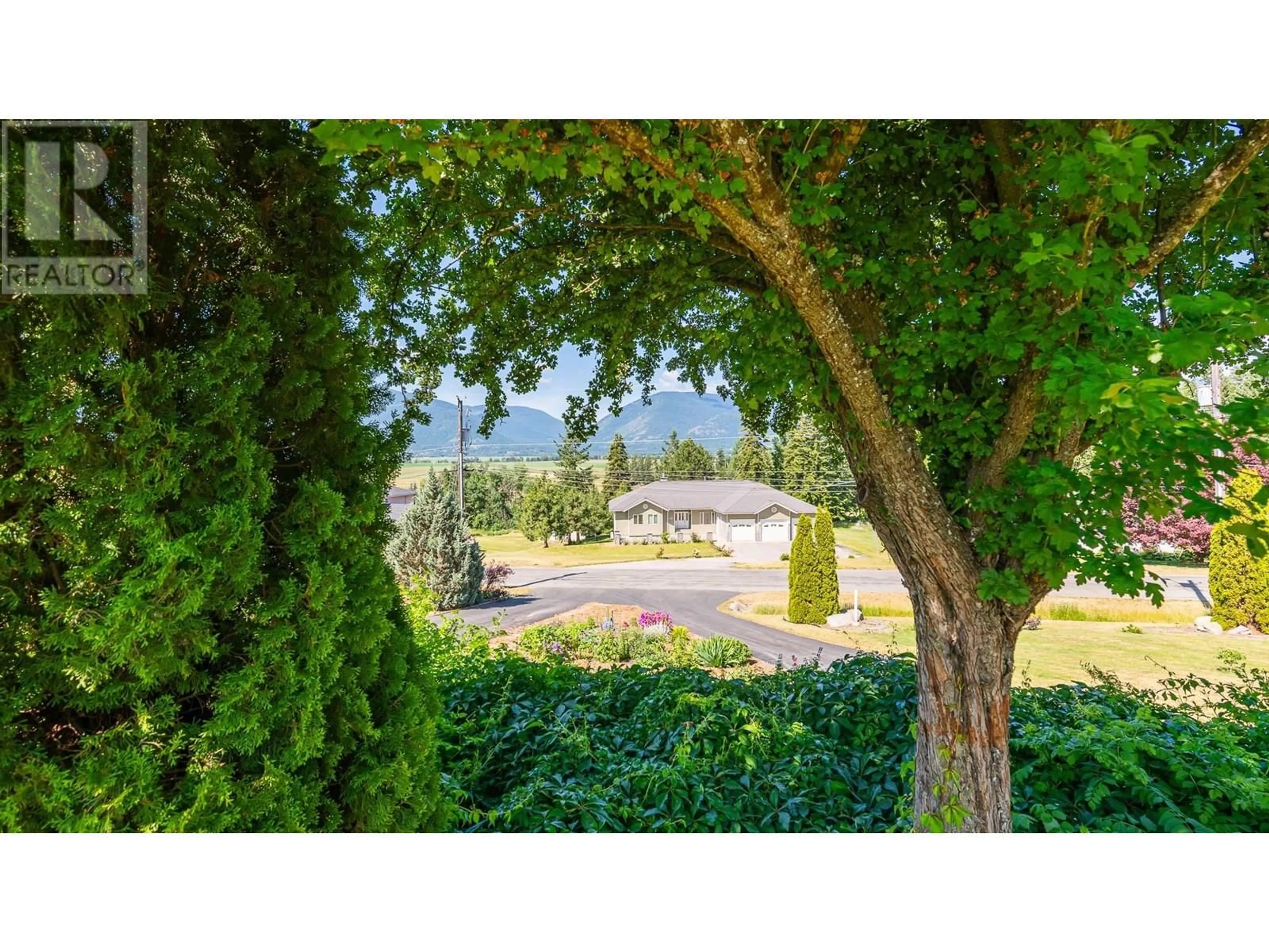 A pic from outside/outdoor area/front of a property/back of a property/a pic from drone, forest/trees view for 1506 1ST  NW AVENUE, Creston British Columbia V0B1G6