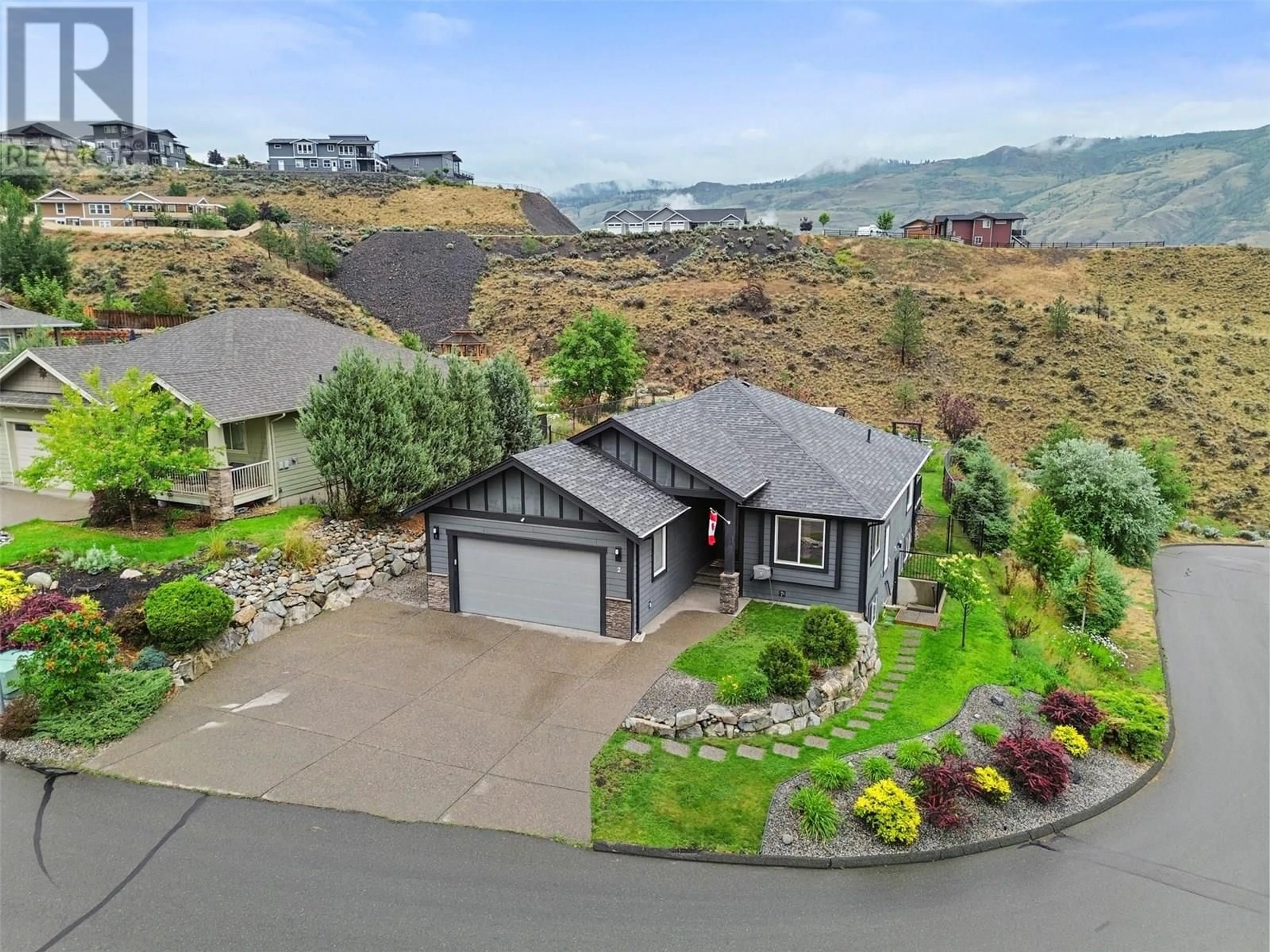 A pic from outside/outdoor area/front of a property/back of a property/a pic from drone, mountain view for 2 - 950 IDA LANE, Kamloops British Columbia V2B0C6