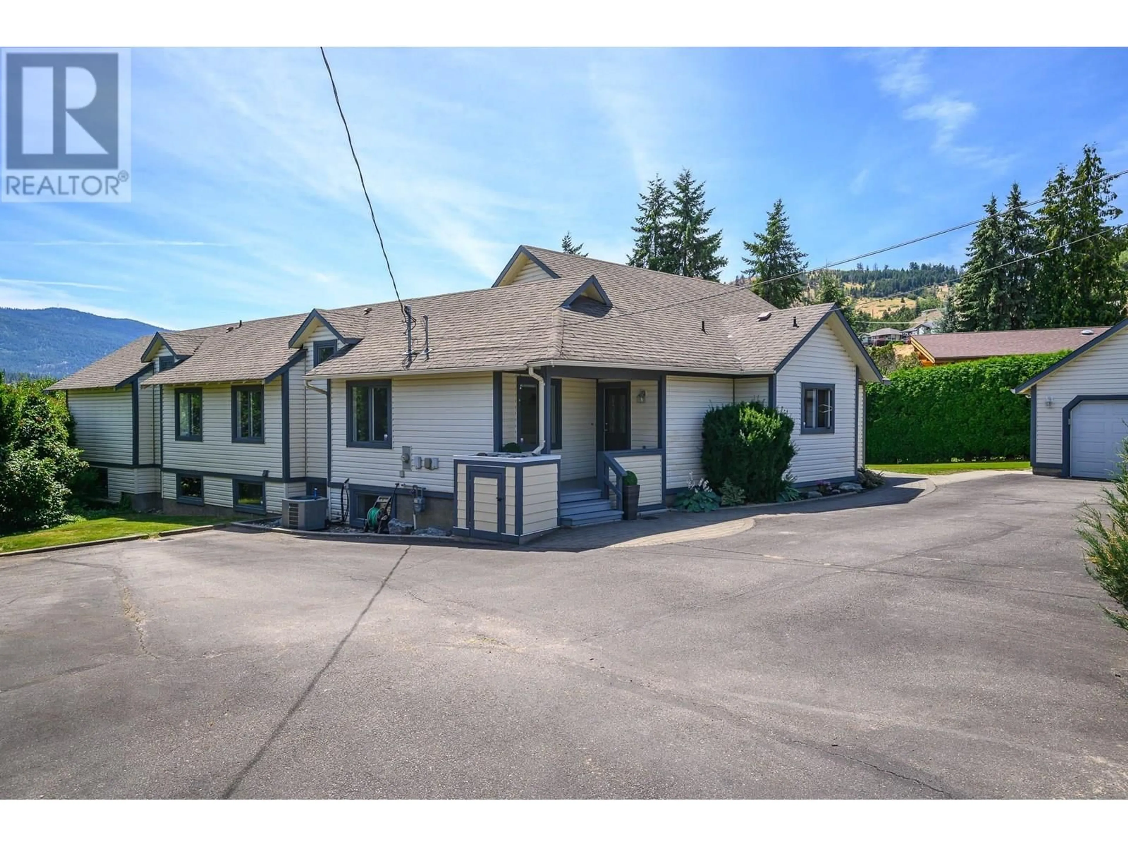 A pic from outside/outdoor area/front of a property/back of a property/a pic from drone, street for 13522 WESTKAL ROAD, Coldstream British Columbia V1B1Y5
