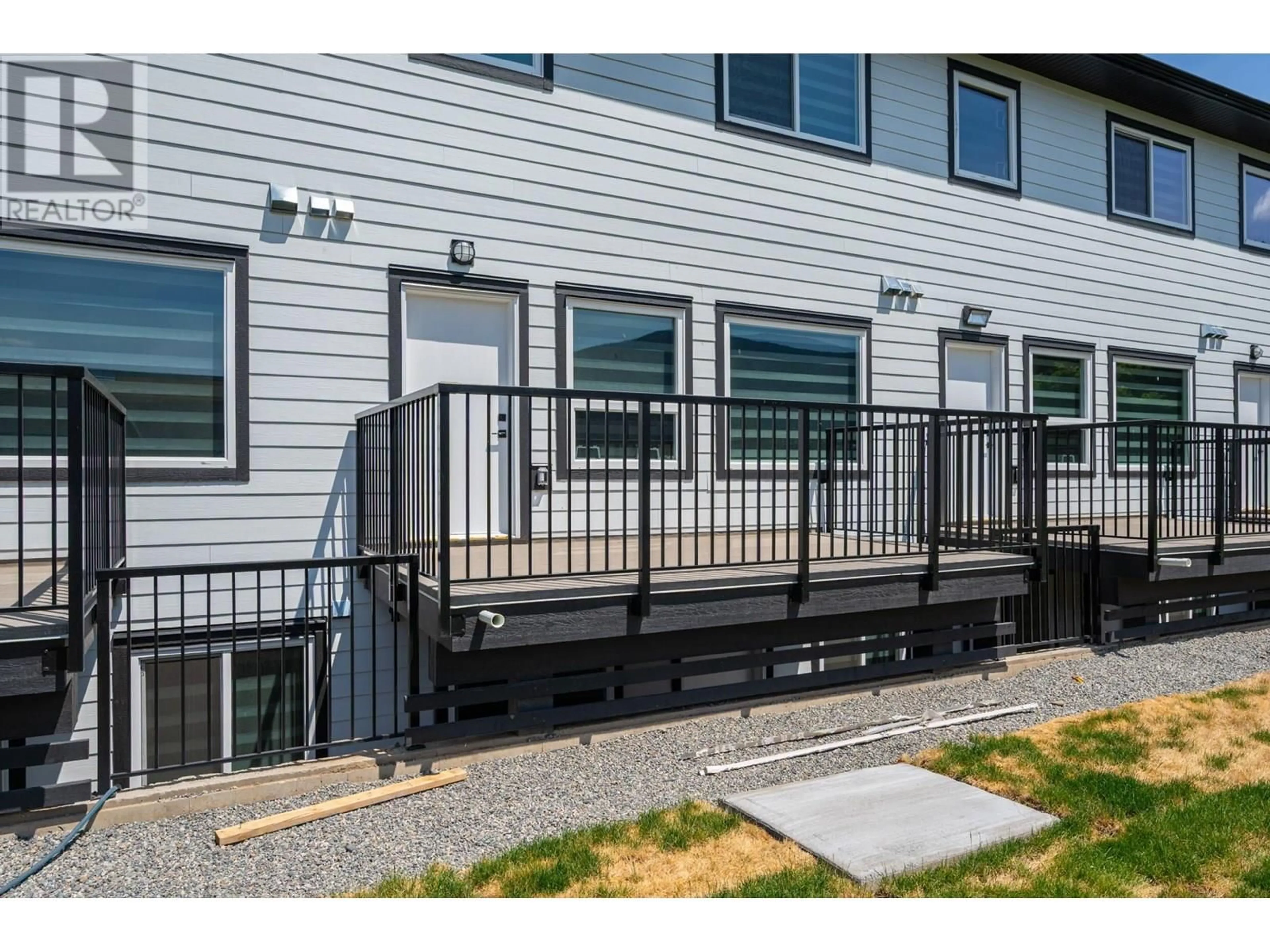 Home with vinyl exterior material, street for 3 - 2502 CLAPPERTON AVENUE, Merritt British Columbia V1K1A2